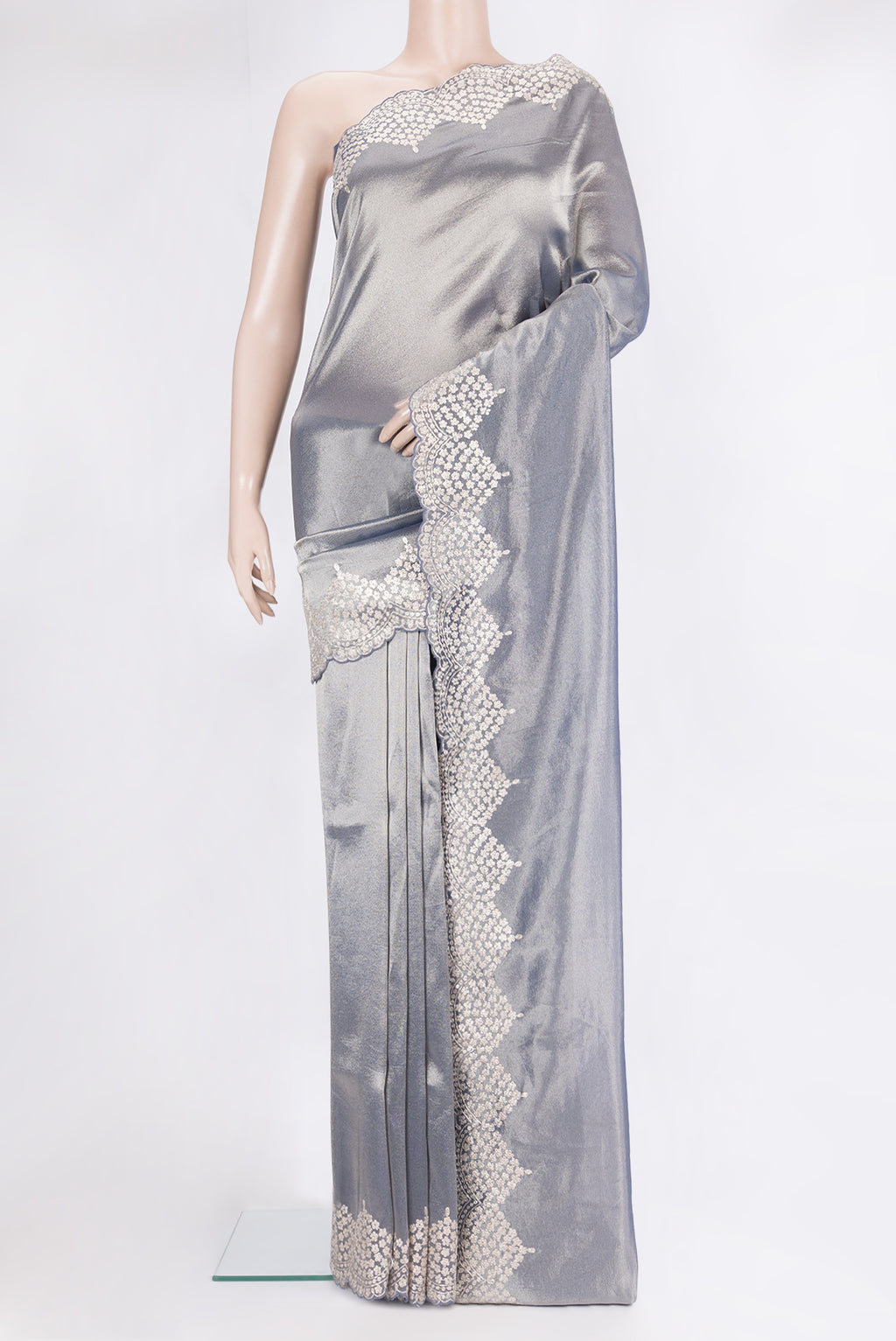 Grey Organza Saree with Plain Body and Embroidery Border.  displayed on a mannequin