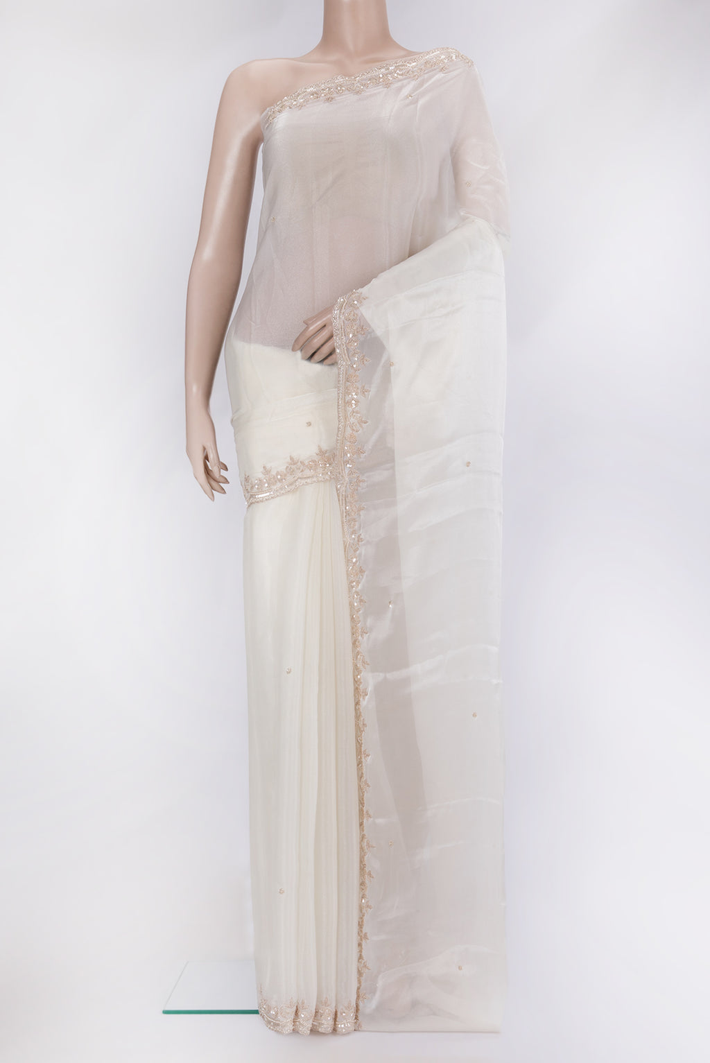 Off White Organza Silk Saree with Embroidery on the body and Embroidery Border.  displayed on a mannequin