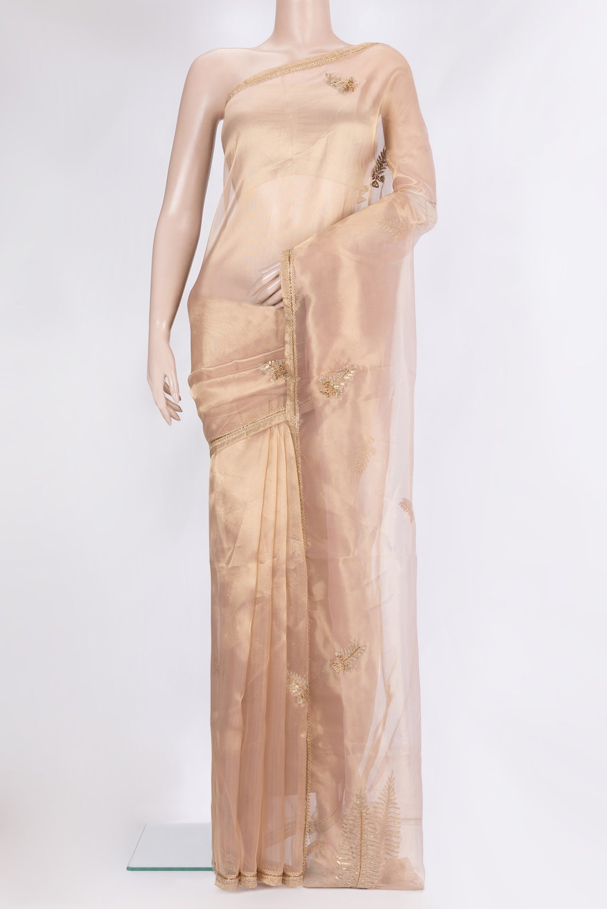 Gold Dual Tone Organza Saree with Embroidery on the body and Embroidery Border.  displayed on a mannequin