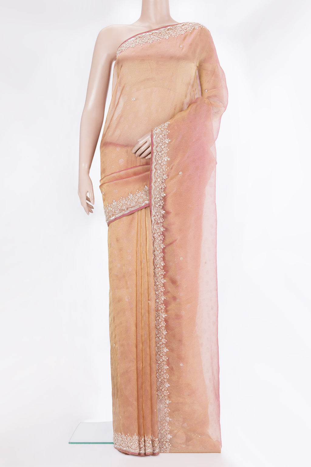 Rose Gold Dual Tone Organza Saree with Embroidery on the body and Sequin Border.  displayed on a mannequin