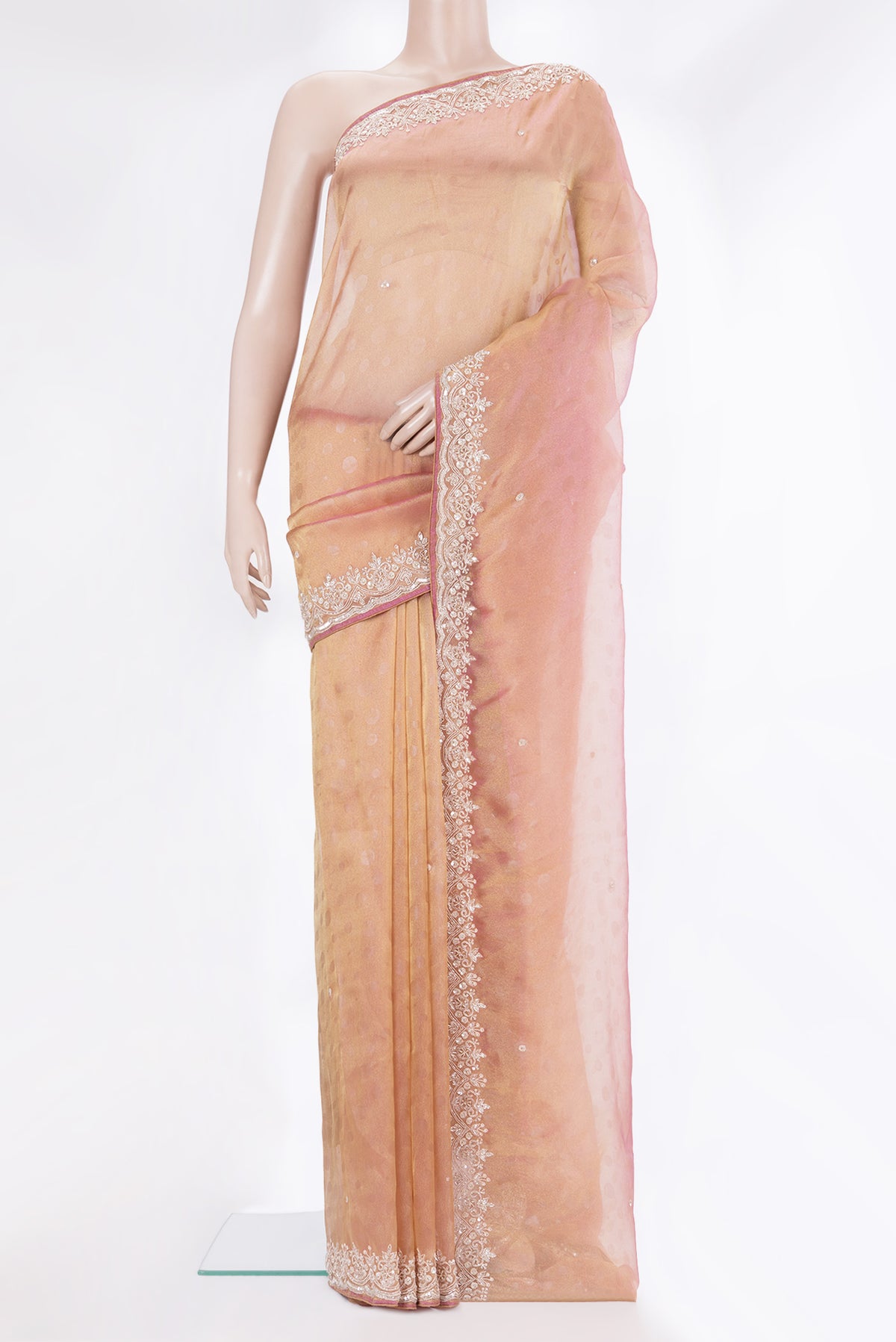 Rose Gold Dual Tone Organza Saree with Embroidery on the body and Sequin Border.  displayed on a mannequin