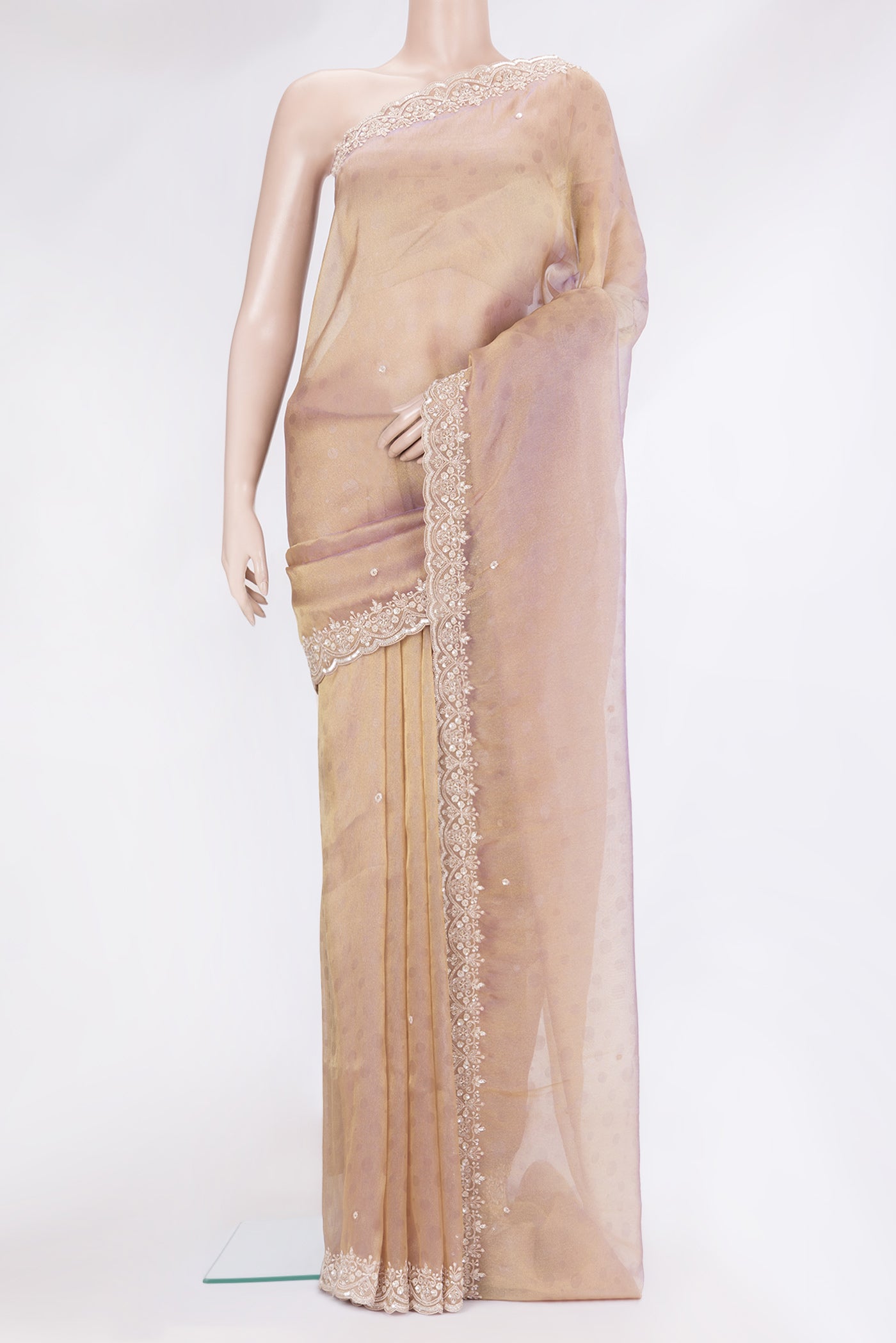 Gold Dual Tone Georgette Saree with Embroidery on the body and Sequin Border.  displayed on a mannequin