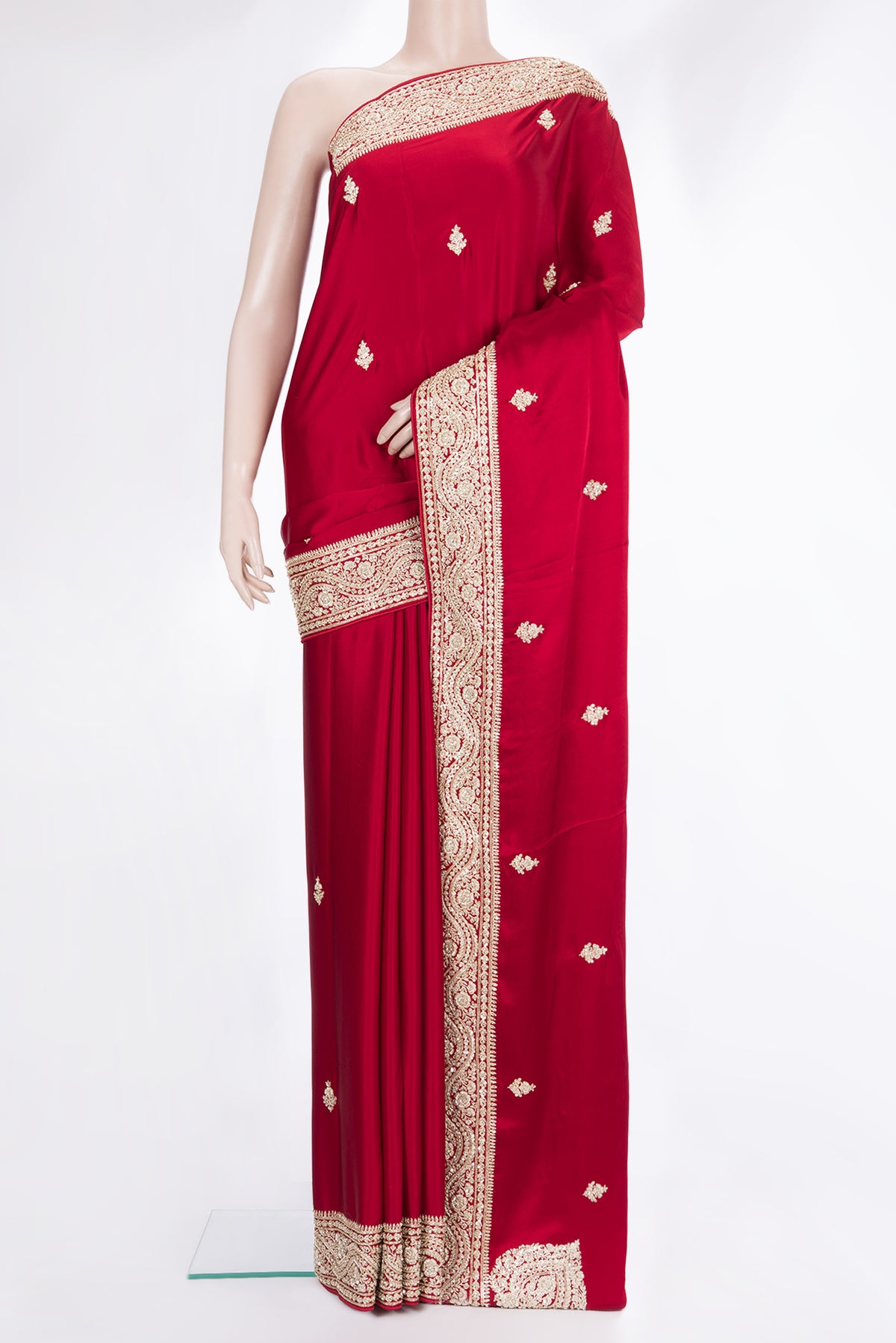 Red Satin Saree with Embroidered on the body and Sequin Border.  displayed on a mannequin