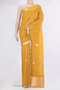 Yellow Organza Silk Saree with Zari Butta on the body and Zari Border.  displayed on a mannequin