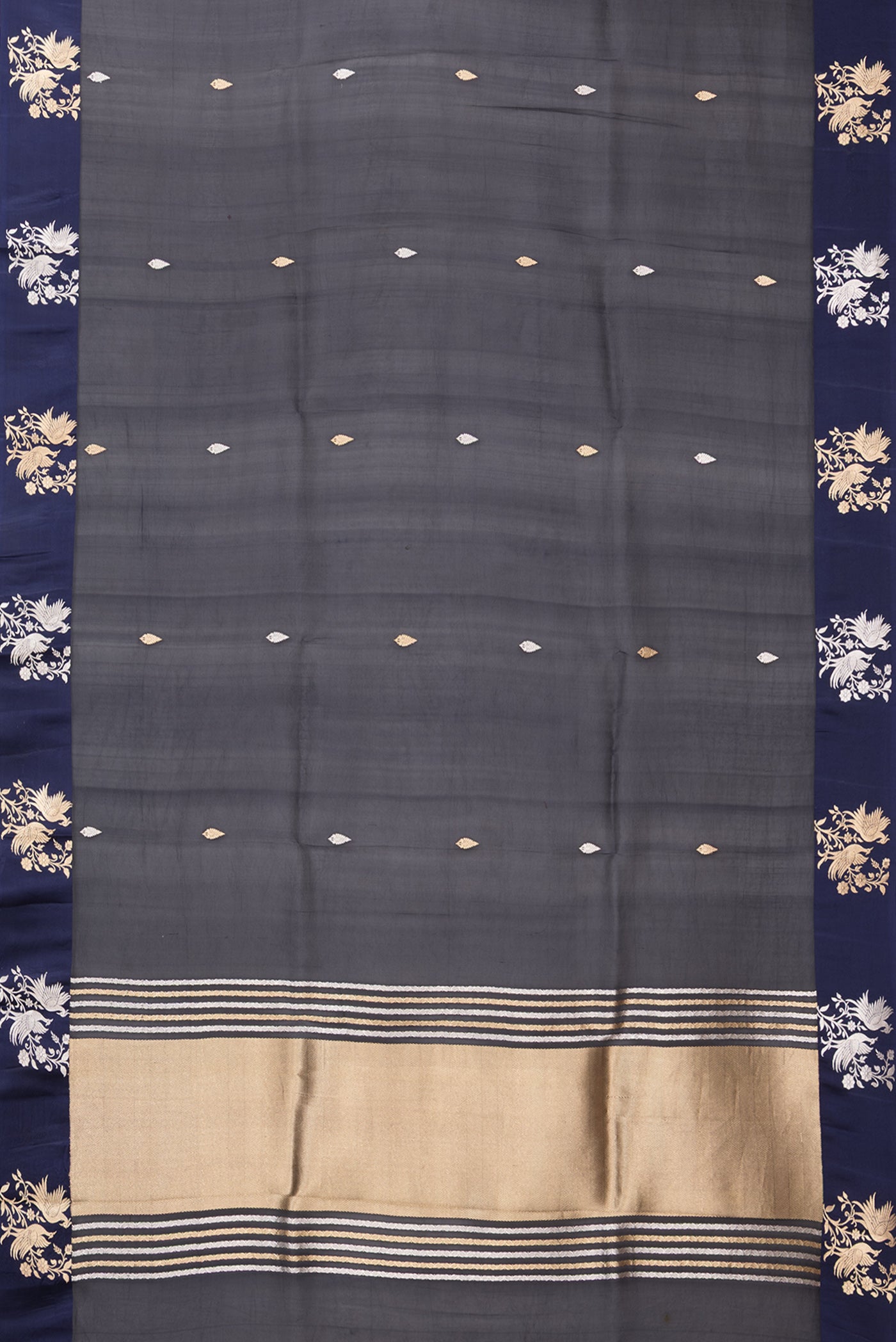 Flat view of Navy Blue Organza Silk Saree with Zari Butta on the body and Fancy Border. 