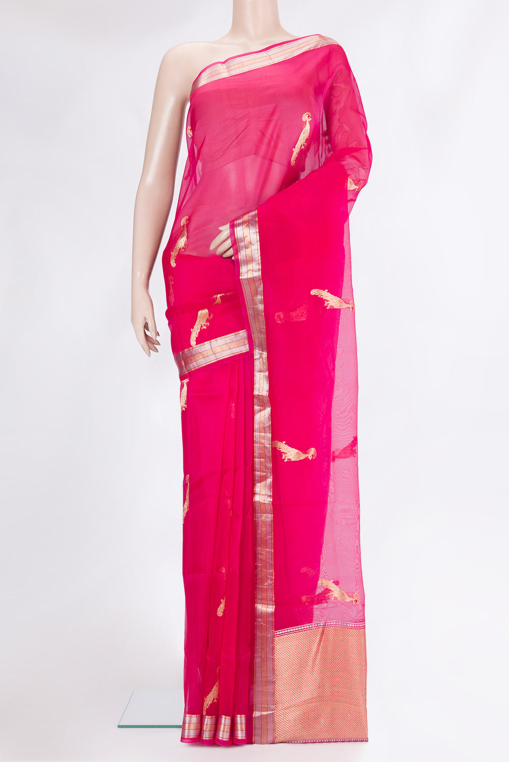 Pink Organza Silk Saree with Zari Butta on the body and Zari Border.  displayed on a mannequin