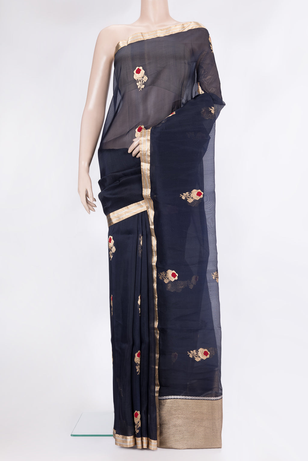 Navy Blue Organza Silk Saree with Zari And Thread Butta on the body and Zari Border.  displayed on a mannequin