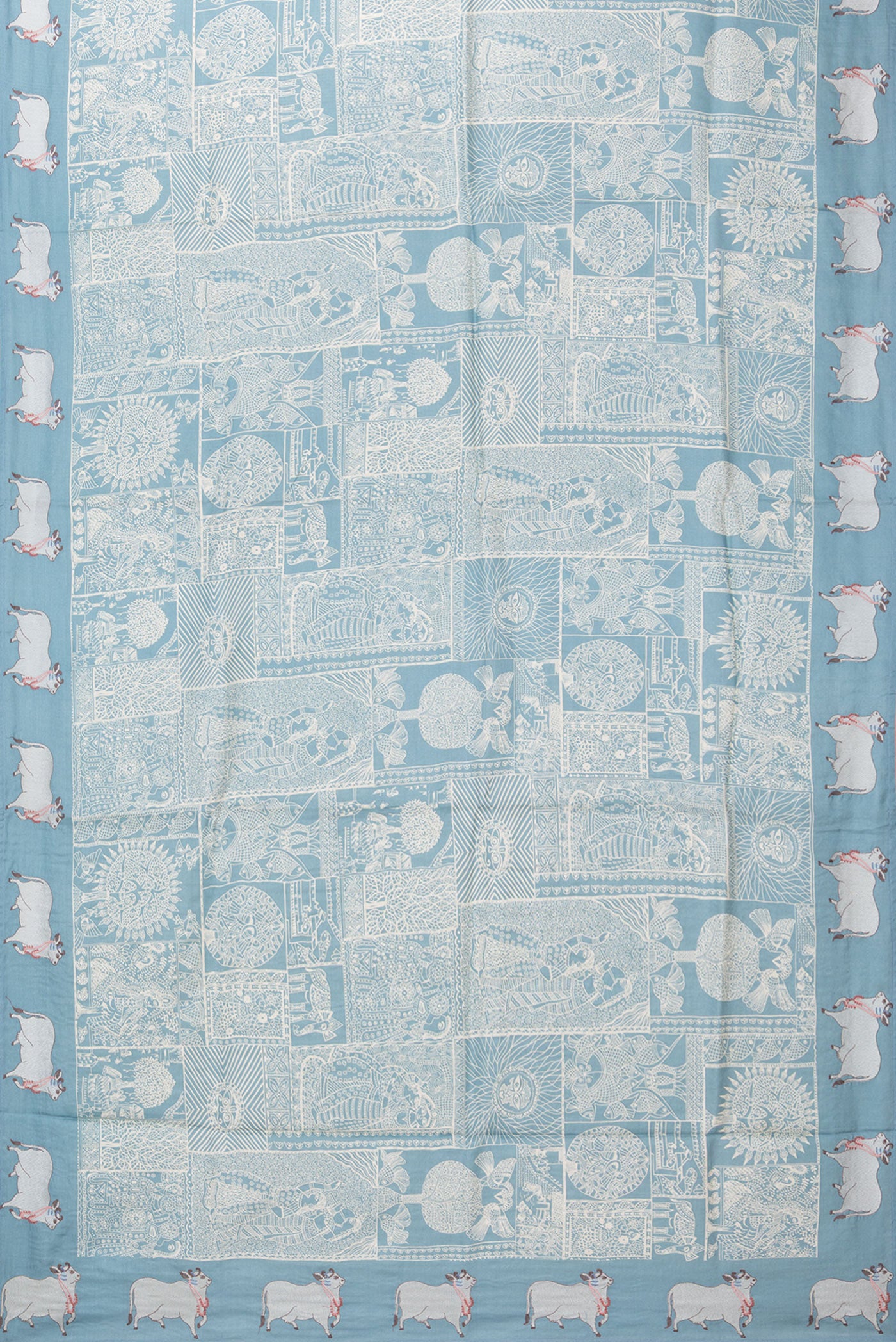 Flat view of Light Blue Tussar Silk Saree with Printed design on the body and Embroidery Border. 