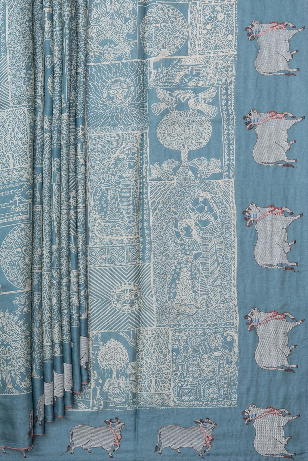 Pleats and pallu of Light Blue Tussar Silk Saree with Printed design on the body and Embroidery Border. 