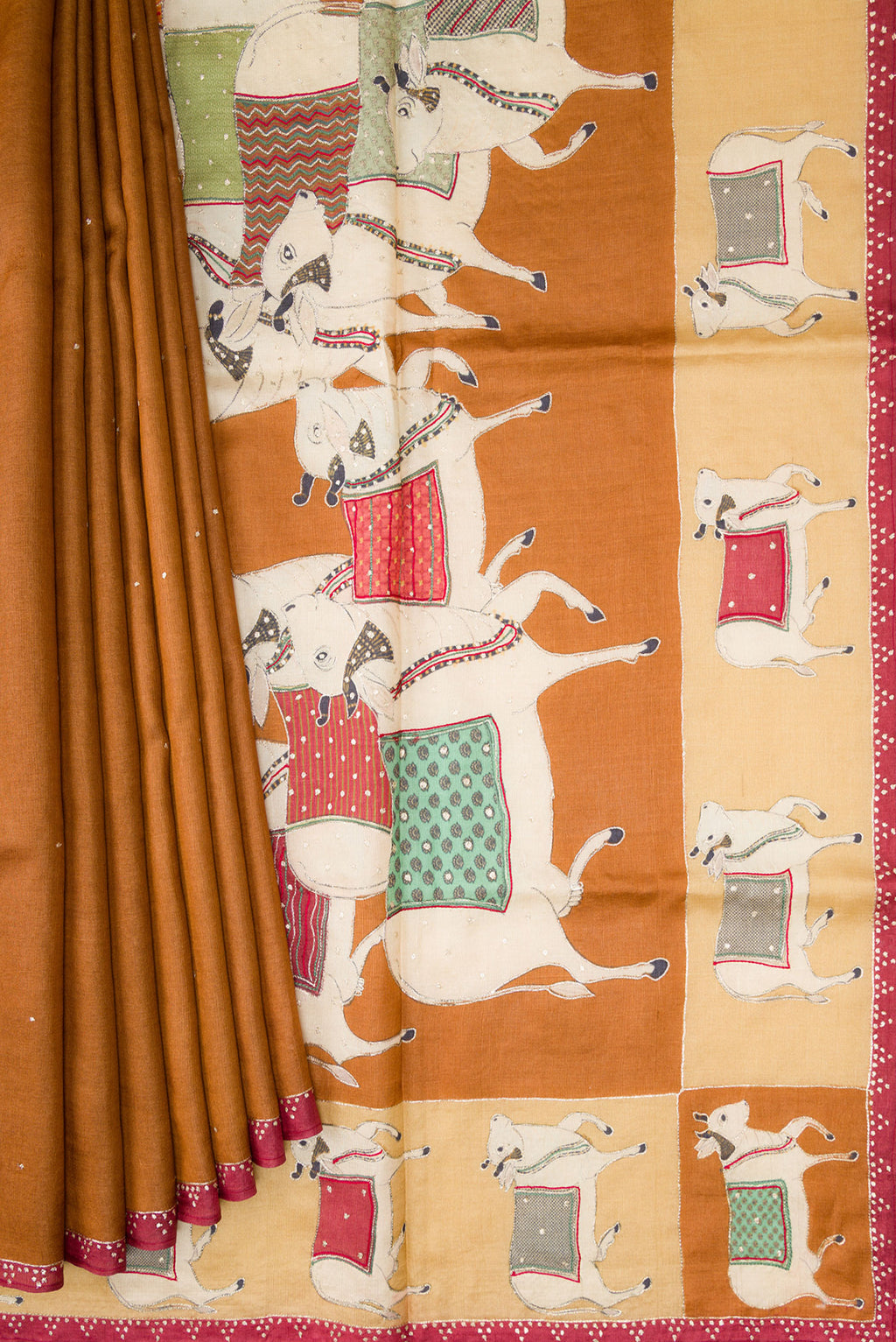 Pleats and pallu of Brick Orange Dual Tone Tussar Silk Saree with Embroidery on the body and Embroidery Border. 