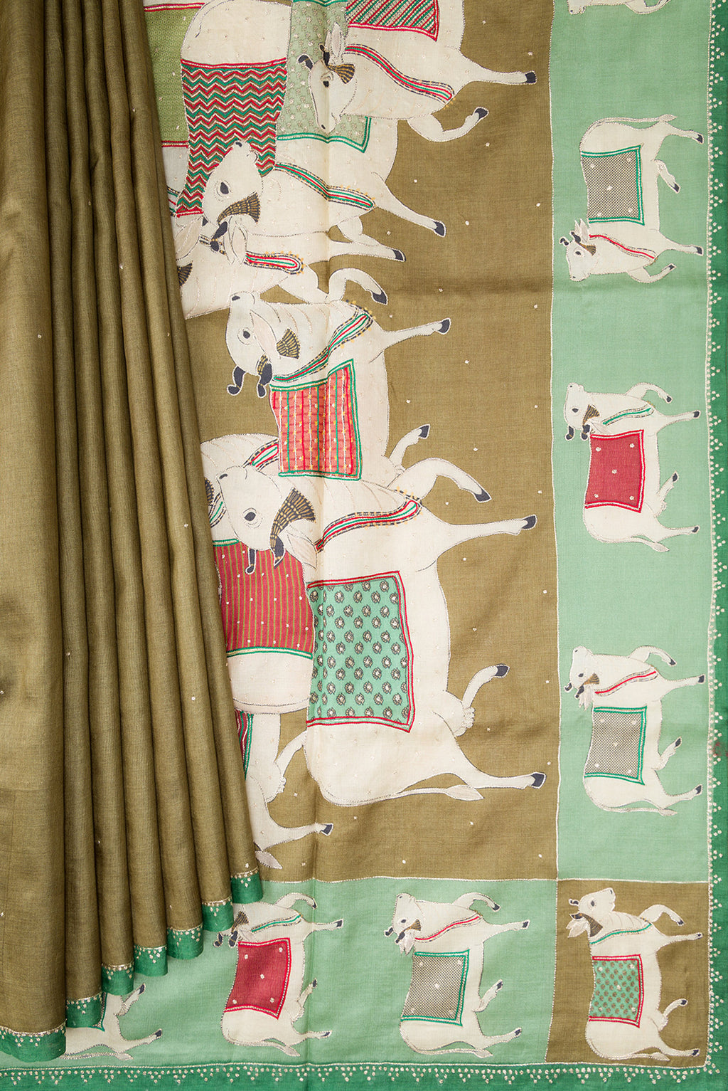 Pleats and pallu of Mehandi Green Dual Tone Tussar Silk Saree with Embroidery on the body and Embroidery Border. 
