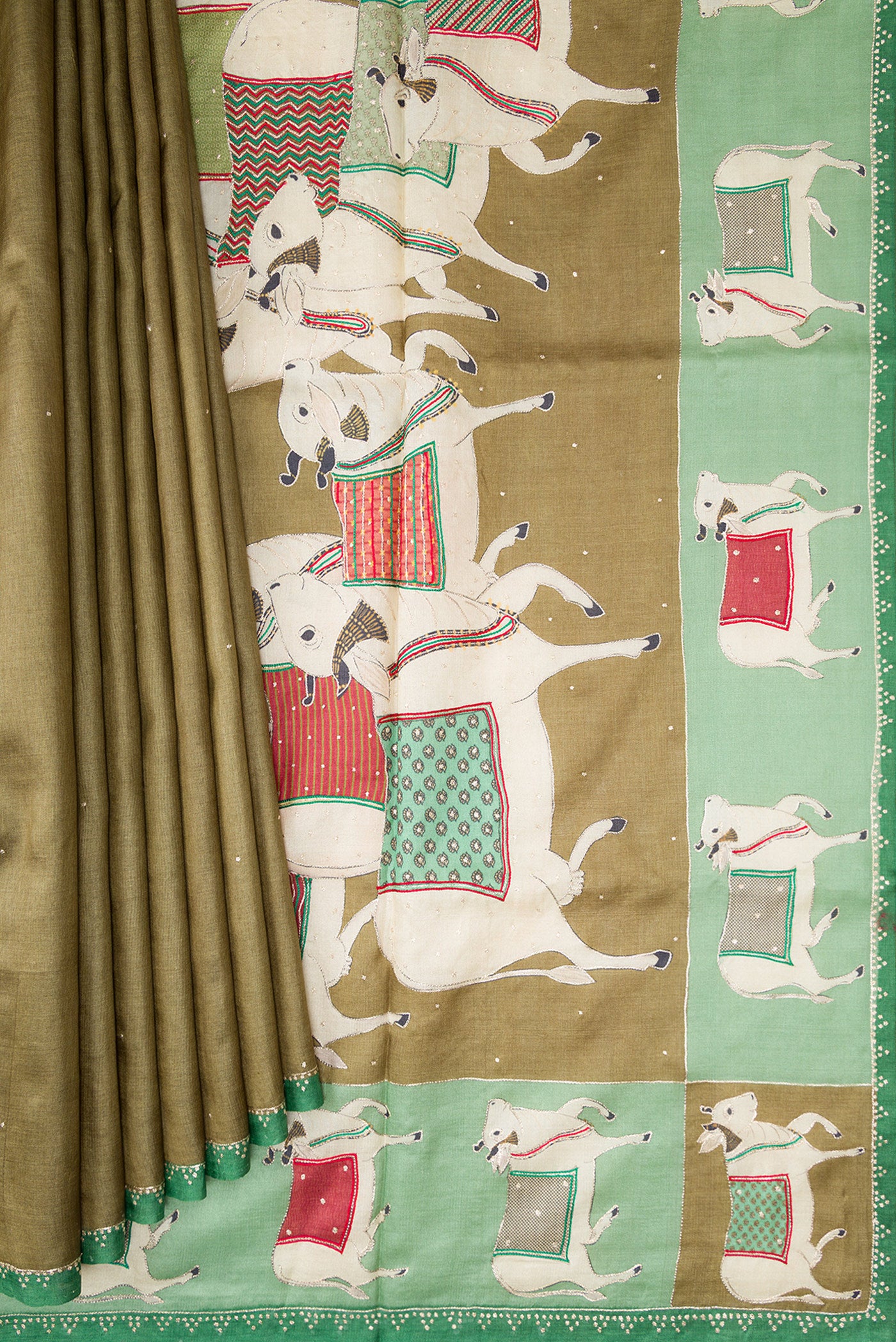 Pleats and pallu of Mehandi Green Dual Tone Tussar Silk Saree with Embroidery on the body and Embroidery Border. 