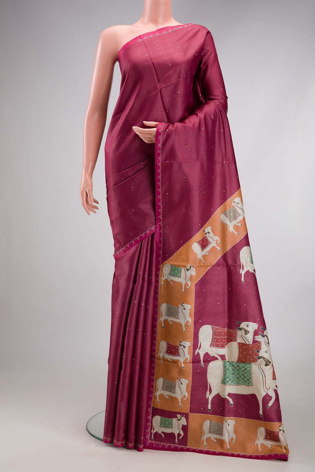 Magenta Dual Tone Tussar Silk Saree with Embroidery on the body and Embroidery Border.  displayed on a mannequin
