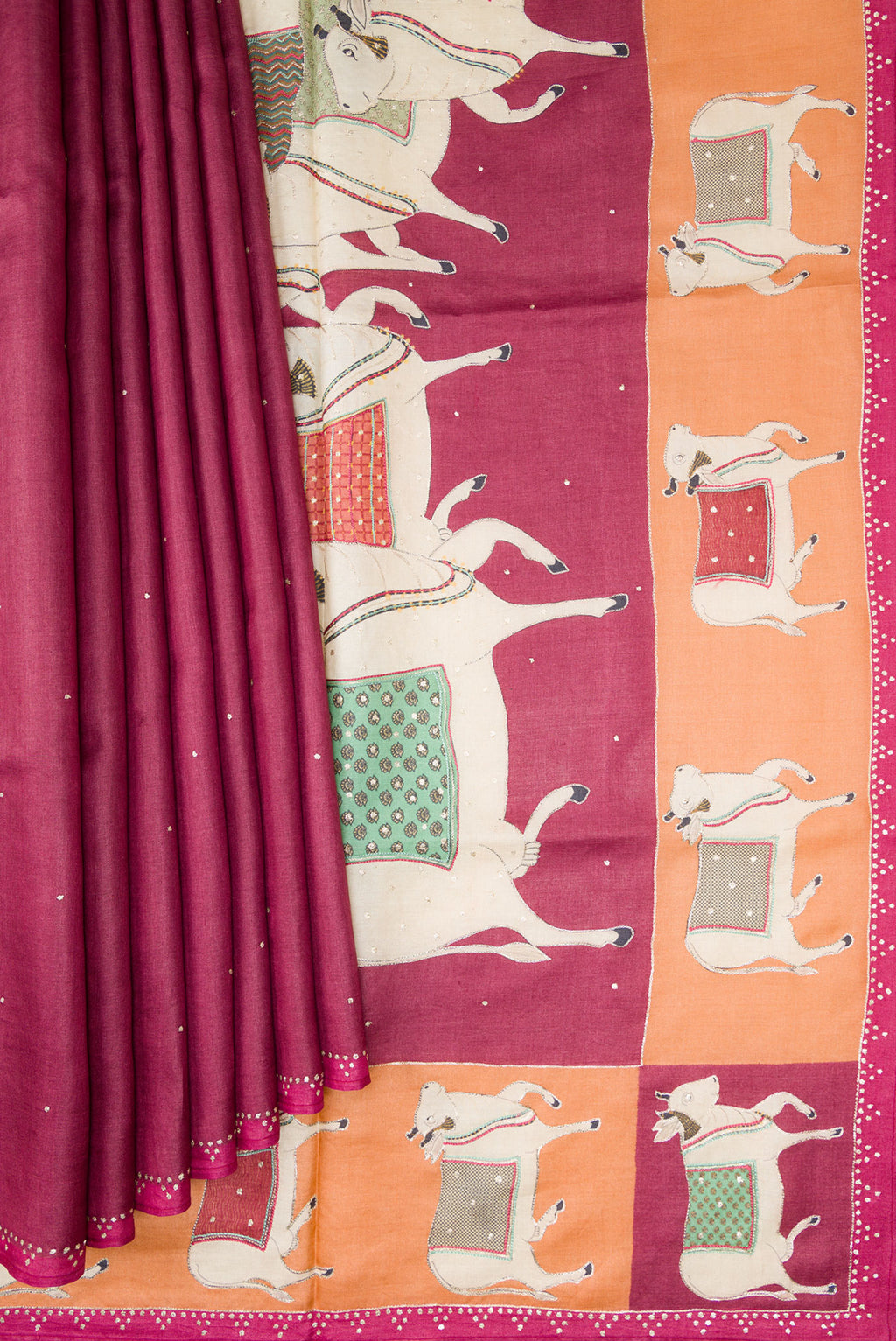 Pleats and pallu of Magenta Dual Tone Tussar Silk Saree with Embroidery on the body and Embroidery Border. 