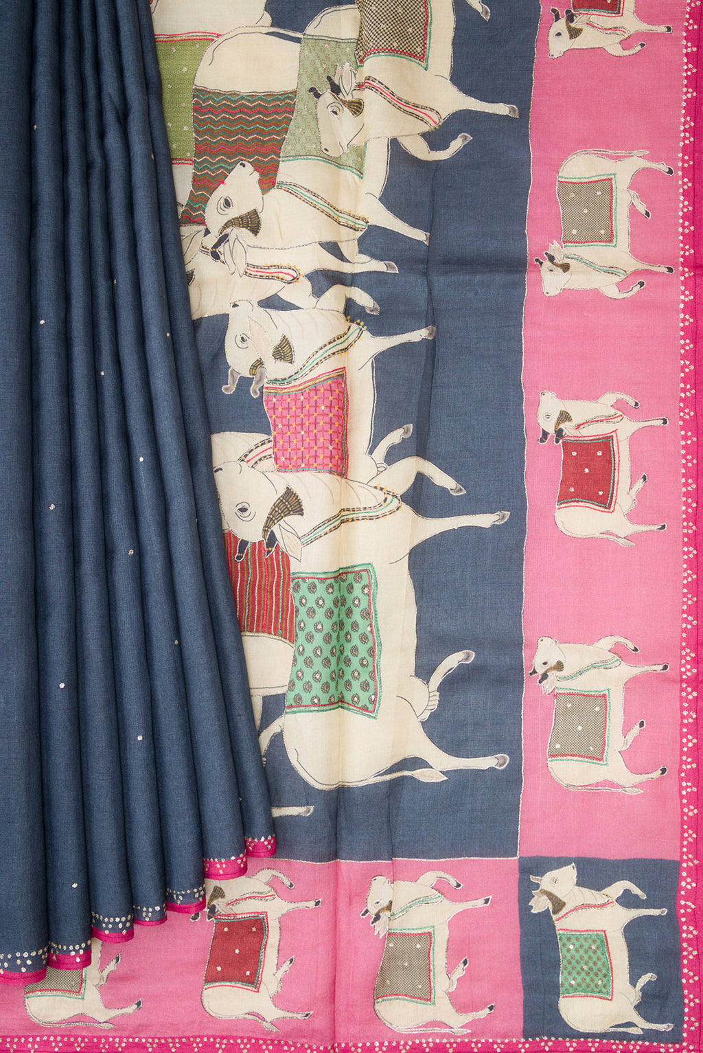 Pleats and pallu of Grey Tussar Silk Saree with Embroidery on the body and Embroidery Border. 