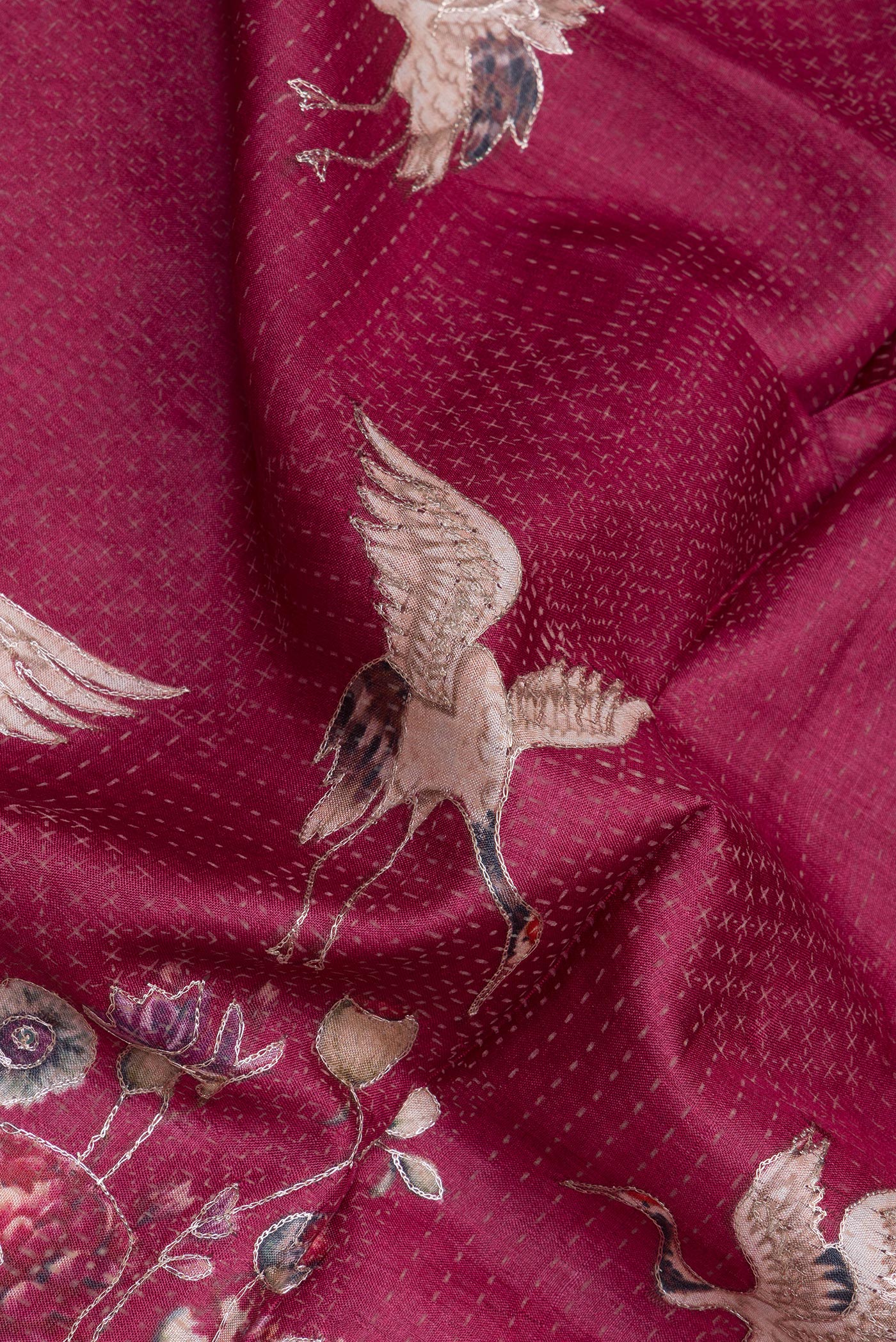 Close up of Maroon Tussar Silk Saree with Embroidery on the body and Embroidery Border.  displaying folds
