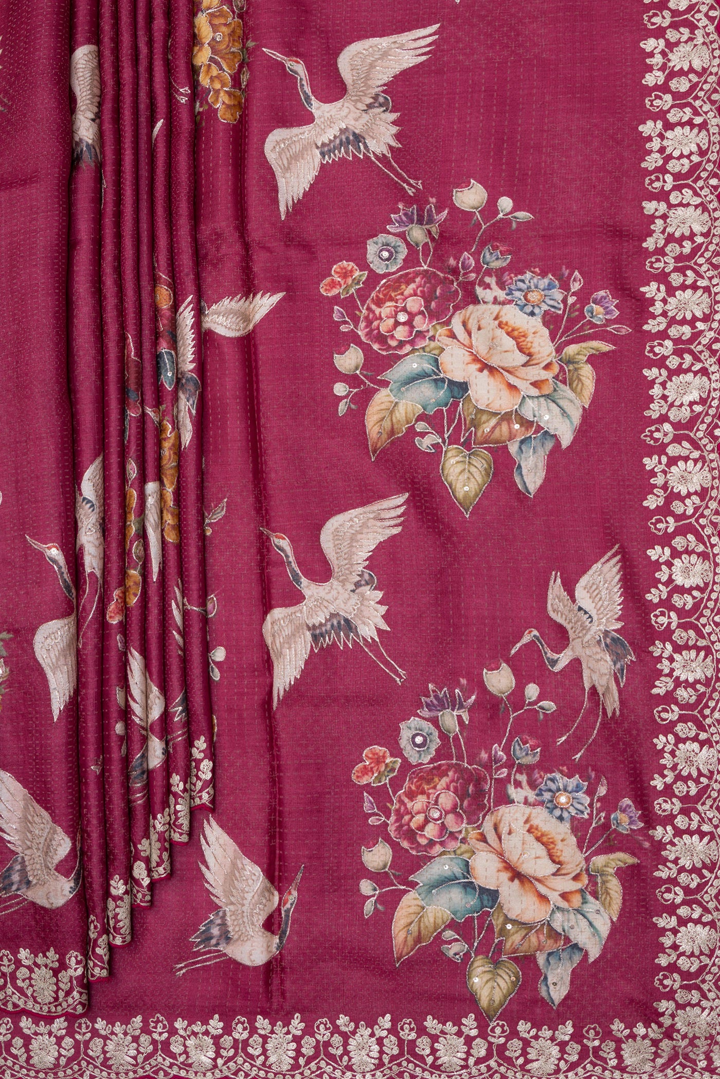 Pleats and pallu of Maroon Tussar Silk Saree with Embroidery on the body and Embroidery Border. 