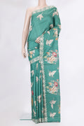Green Tussar Silk Saree with Embroidery on the body and Embroidery Border.  displayed on a mannequin