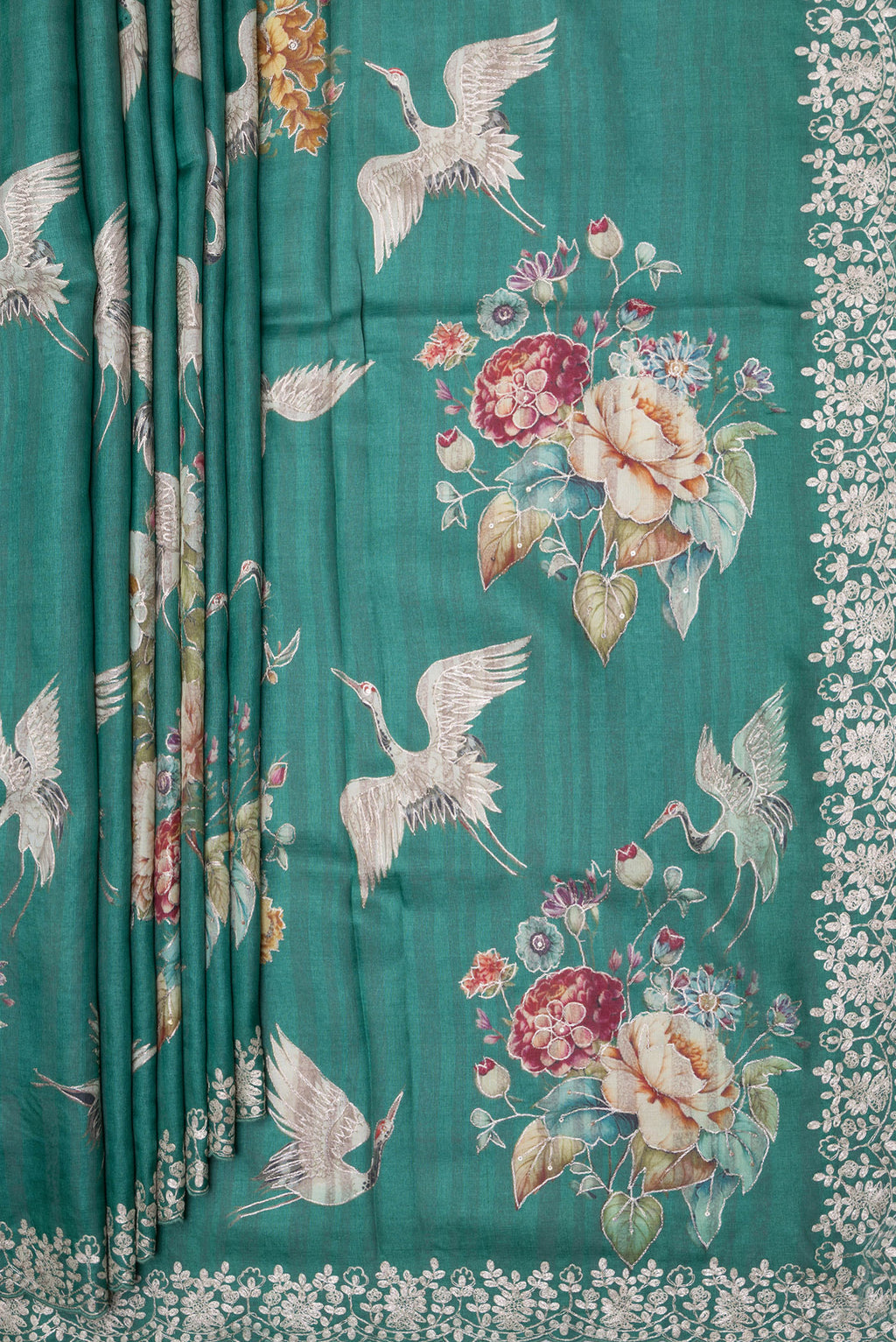 Pleats and pallu of Green Tussar Silk Saree with Embroidery on the body and Embroidery Border. 