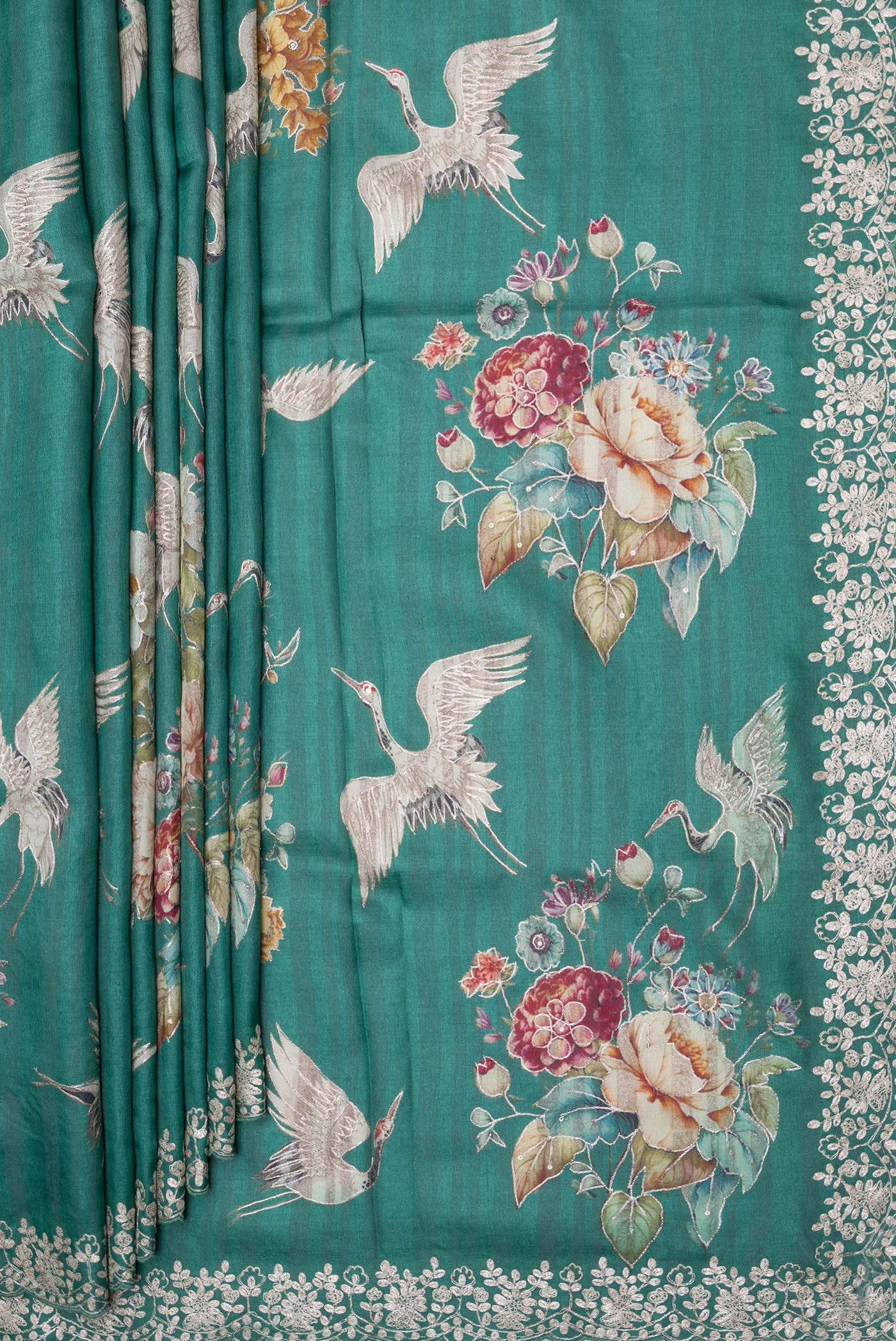 Pleats and pallu of Green Tussar Silk Saree with Embroidery on the body and Embroidery Border. 