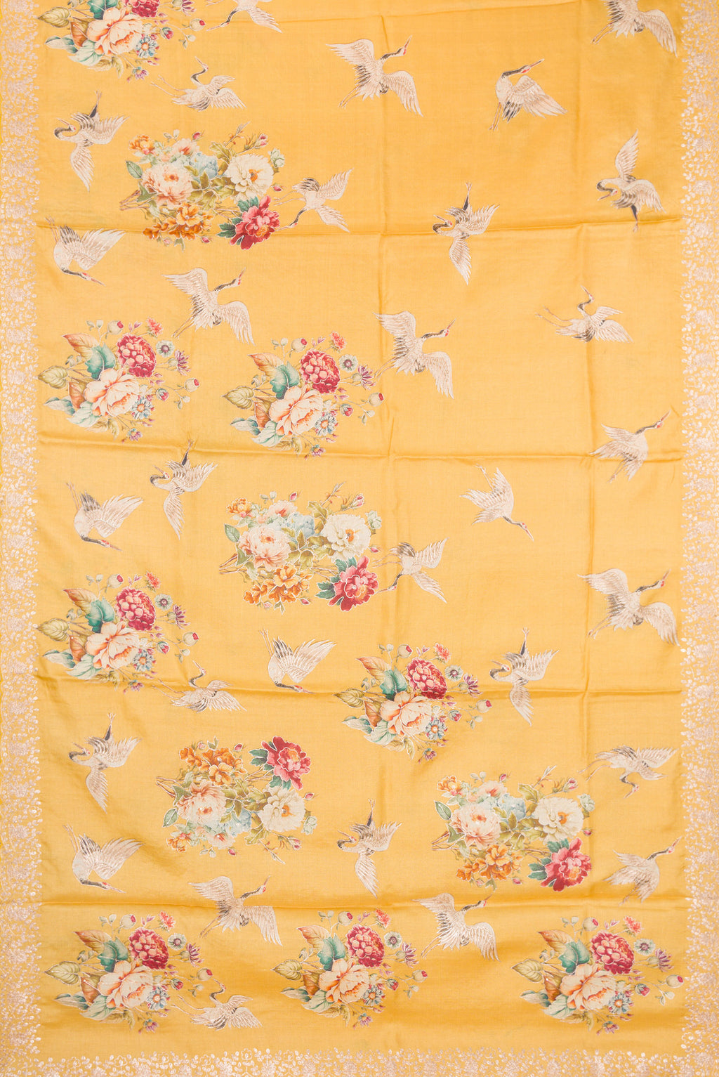 Flat view of Yellow Tussar Silk Saree with Embroidery on the body and Fancy Border. 