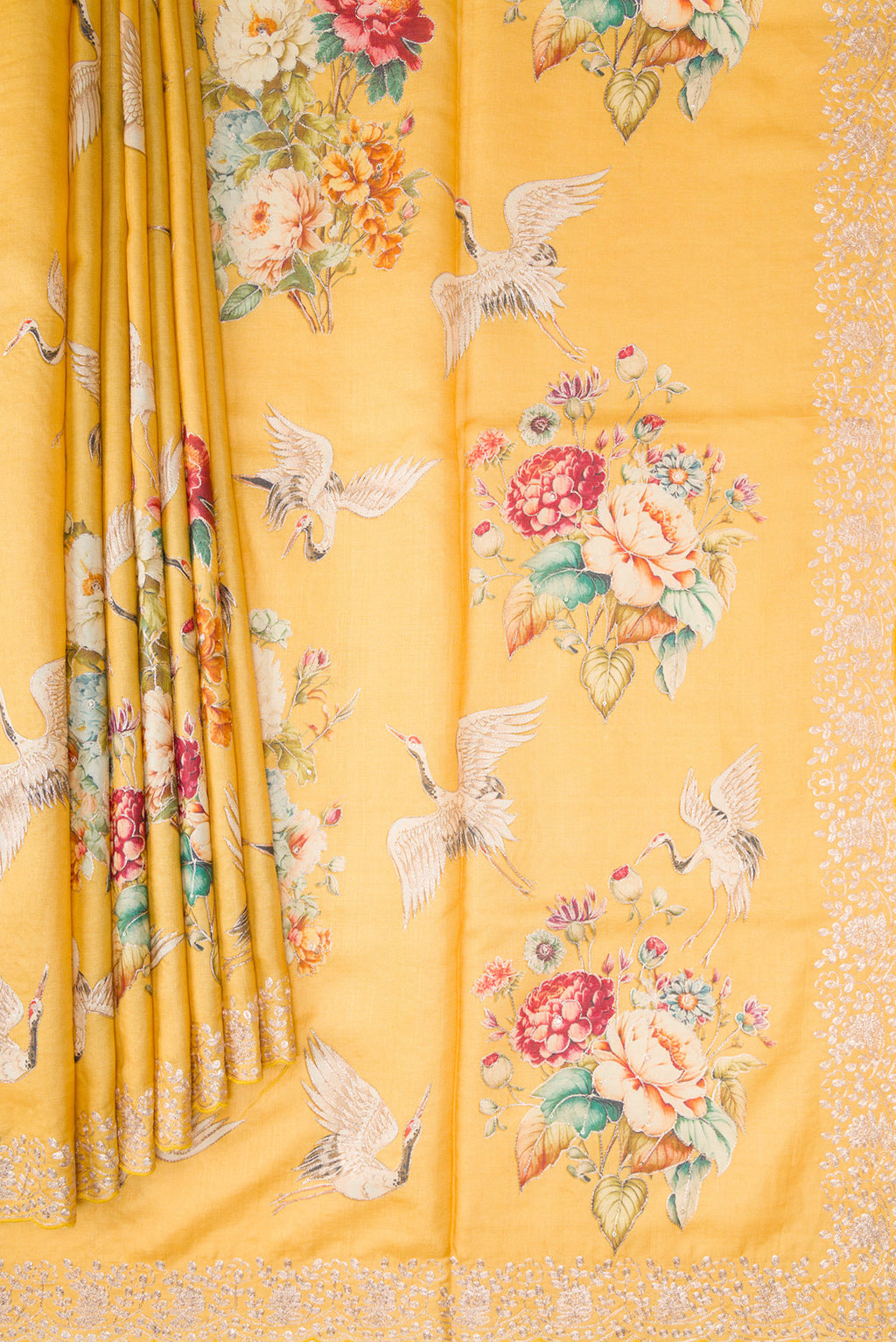 Pleats and pallu of Yellow Tussar Silk Saree with Embroidery on the body and Fancy Border. 