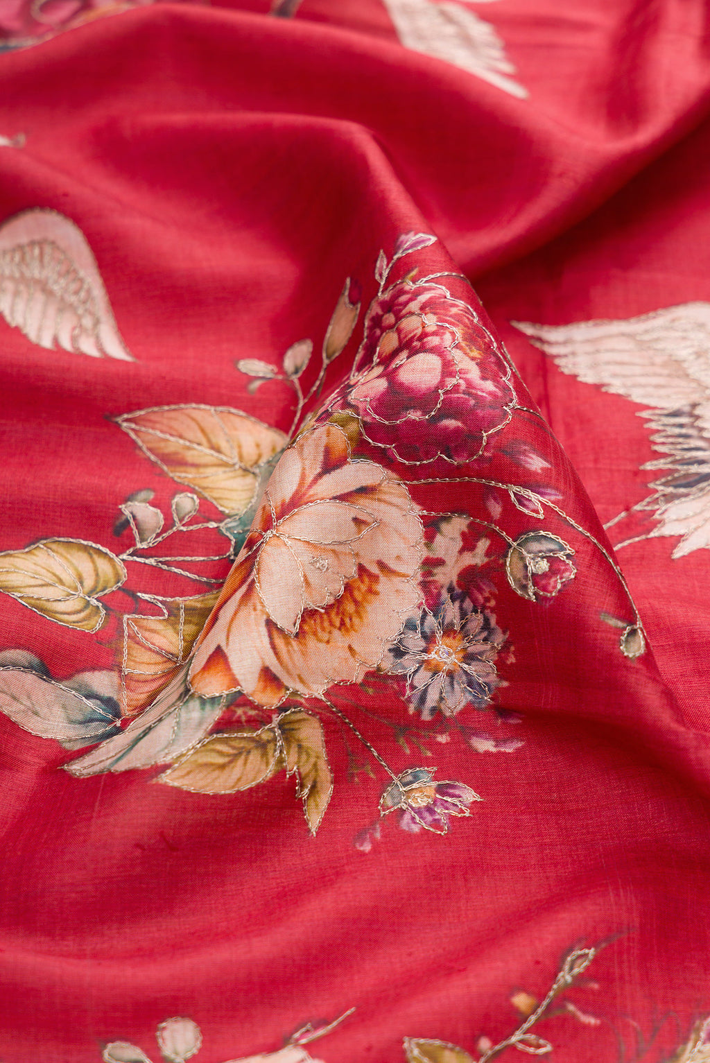 Close up of Maroon Tussar Silk Saree with Embroidery on the body and Fancy Border.  displaying folds