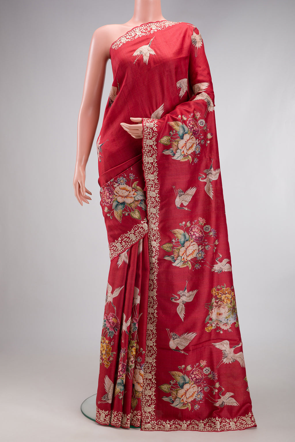 Maroon Tussar Silk Saree with Embroidery on the body and Fancy Border.  displayed on a mannequin