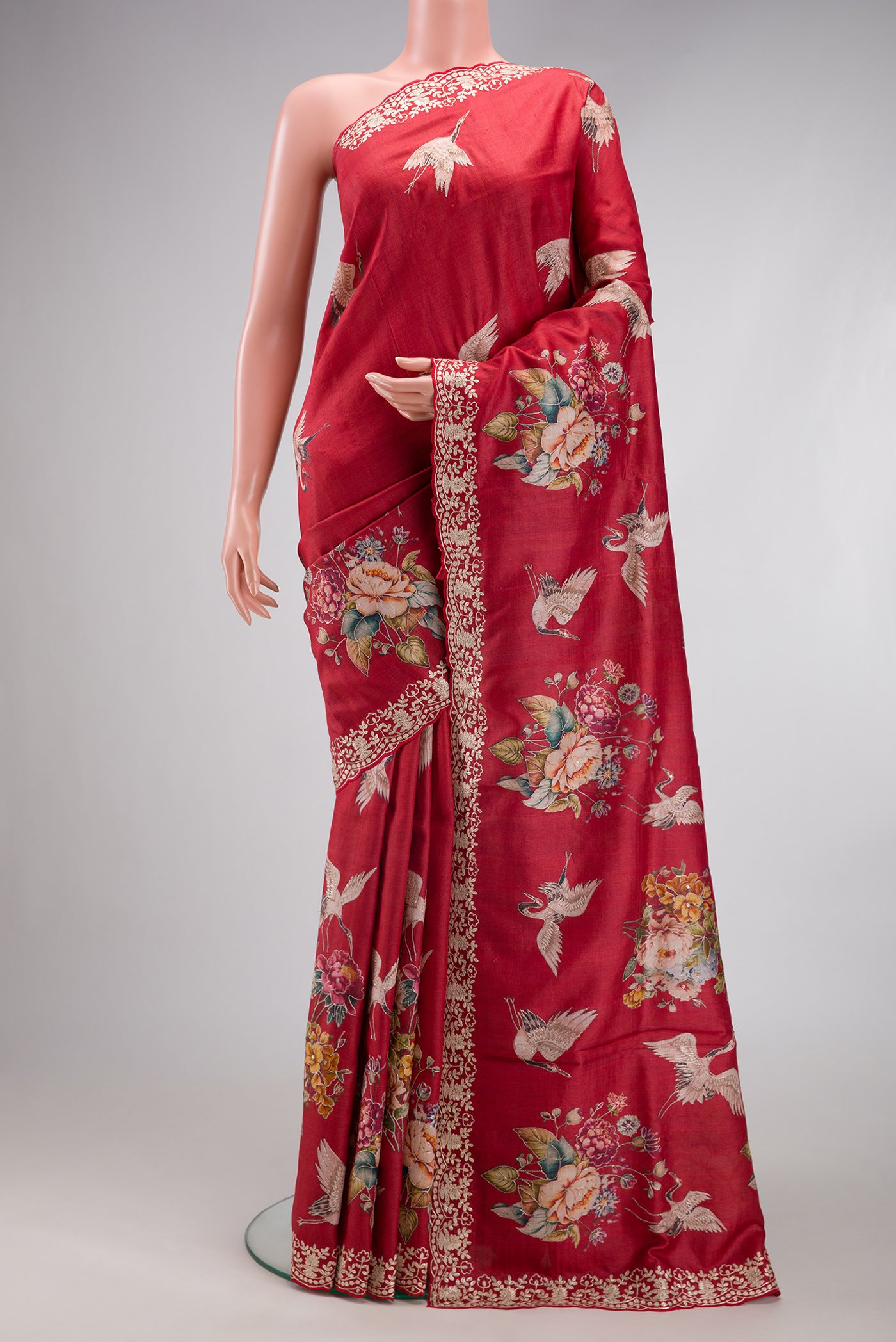 Maroon Tussar Silk Saree with Embroidery on the body and Fancy Border.  displayed on a mannequin