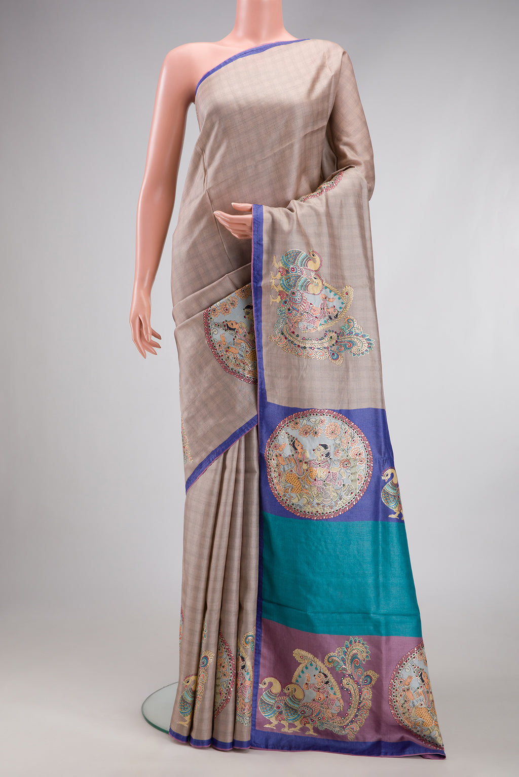 Beige Tussar Silk Saree with Checked design on the body and Plain Border.  displayed on a mannequin