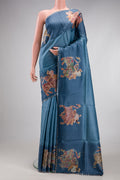 Blue Grey Tussar Silk Saree with Plain Body and Fancy Border.  displayed on a mannequin