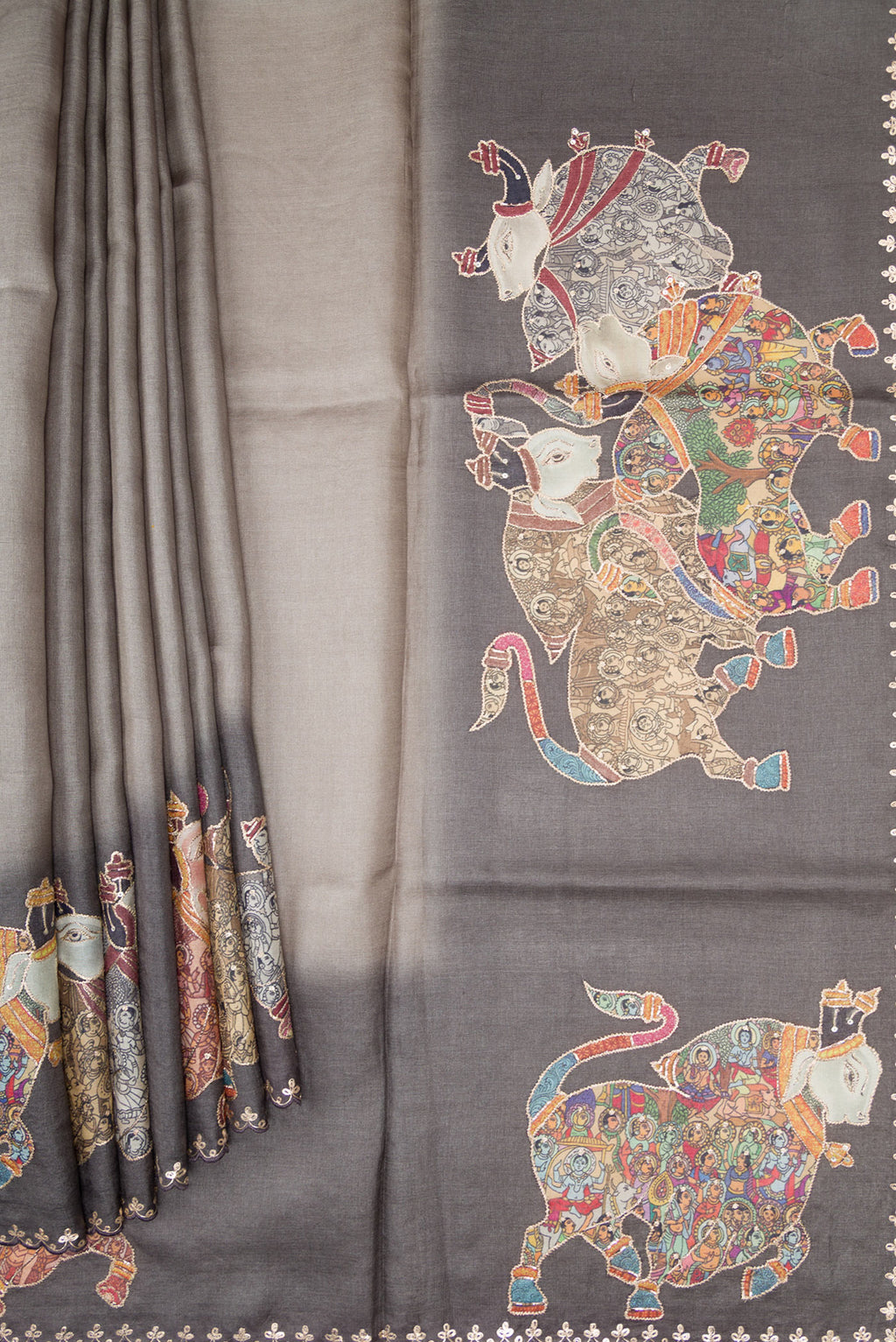 Pleats and pallu of Grey Tussar Silk Saree with Plain Body and Embroidery Border. 