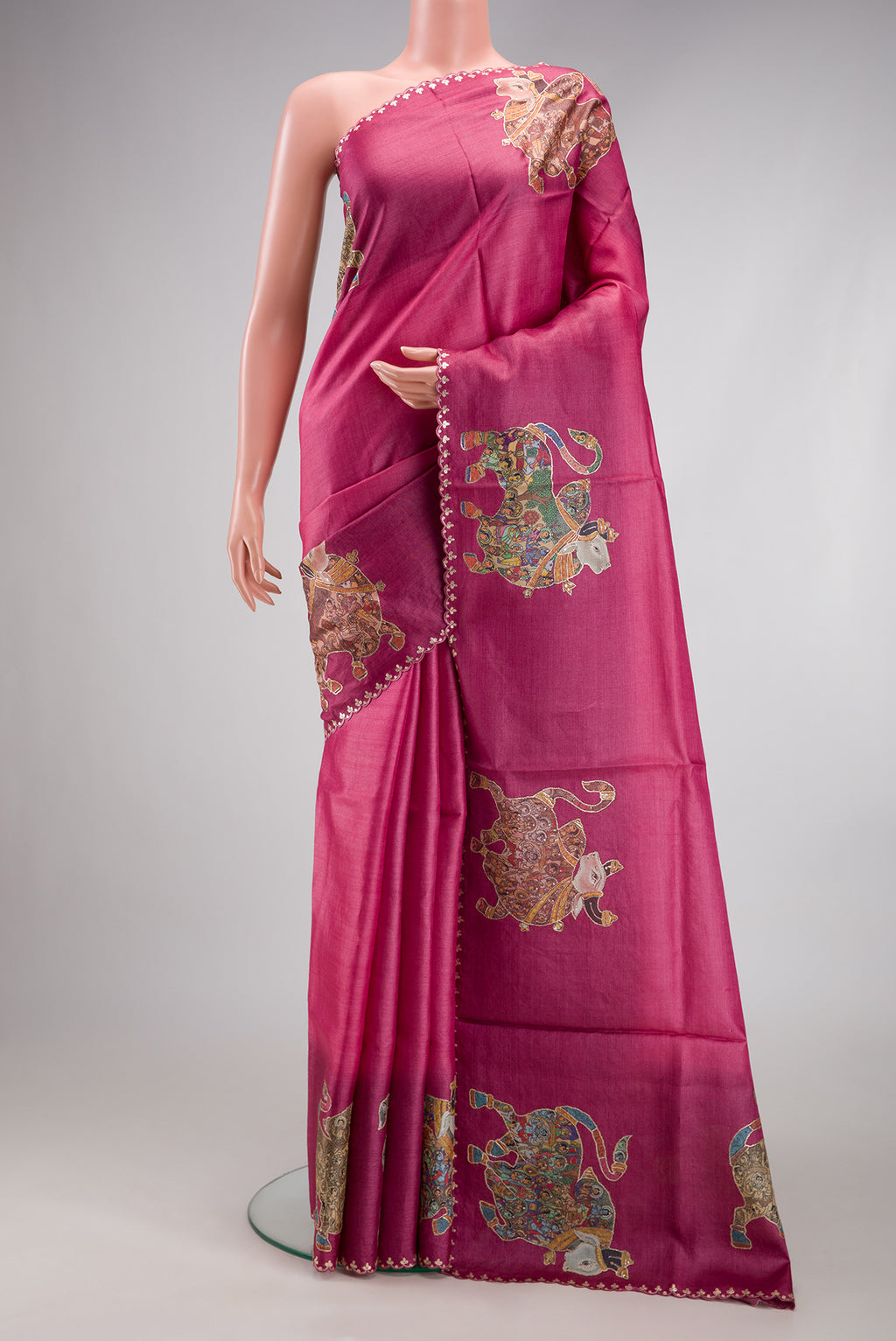 Pink Tussar Silk Saree with Embroidery on the body and Embroidery Border.  displayed on a mannequin