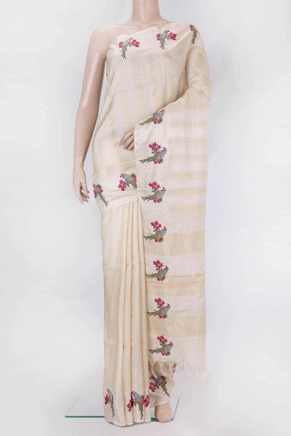 Beige Tussar Silk Saree with Stripes on the body and Fancy Border.  displayed on a mannequin