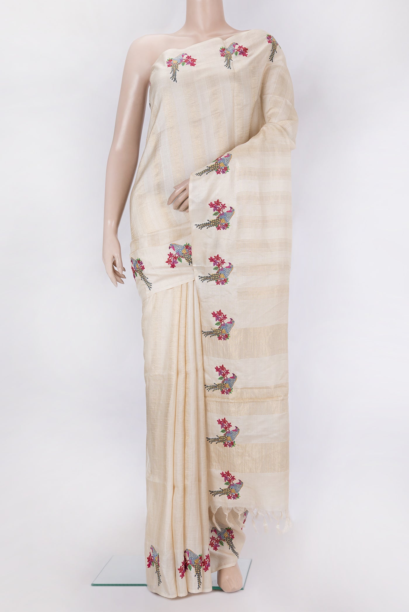 Beige Tussar Silk Saree with Stripes on the body and Fancy Border.  displayed on a mannequin