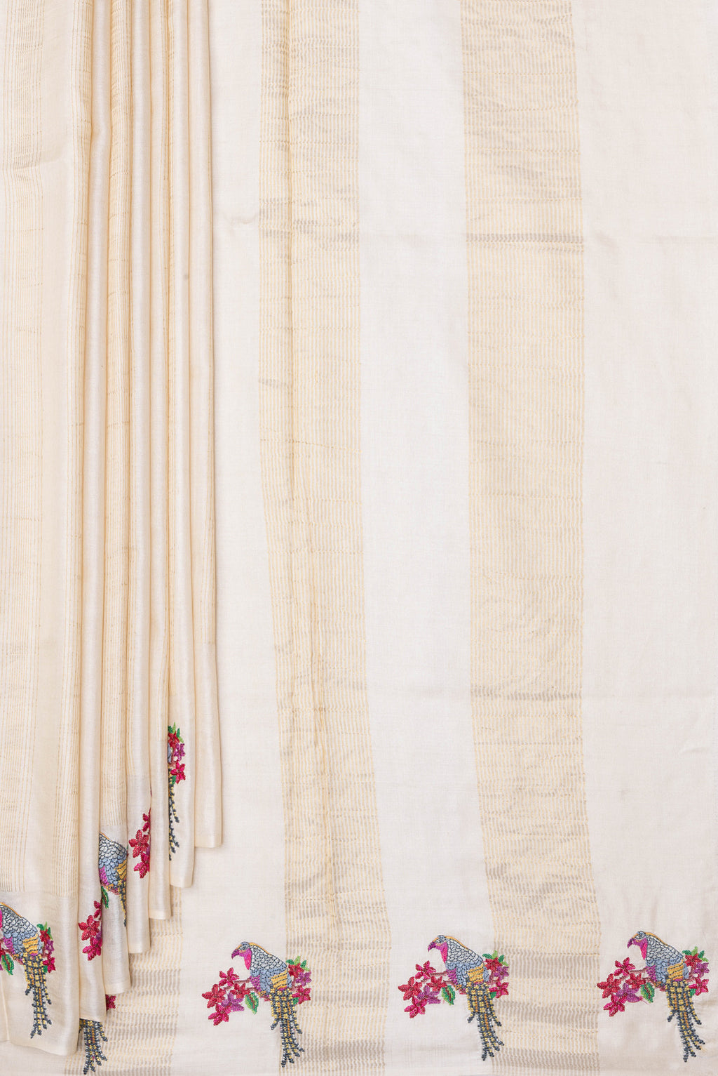 Pleats and pallu of Beige Tussar Silk Saree with Stripes on the body and Fancy Border. 