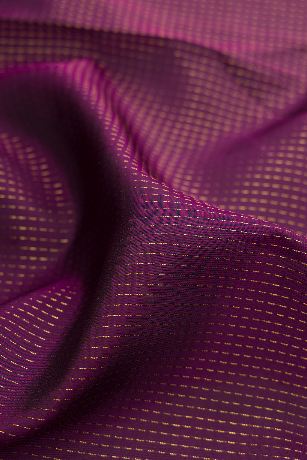 Close up of Burgundy Dual Tone Banarasi Silk Saree with Stripes on the body and Embroidery Border.  displaying folds