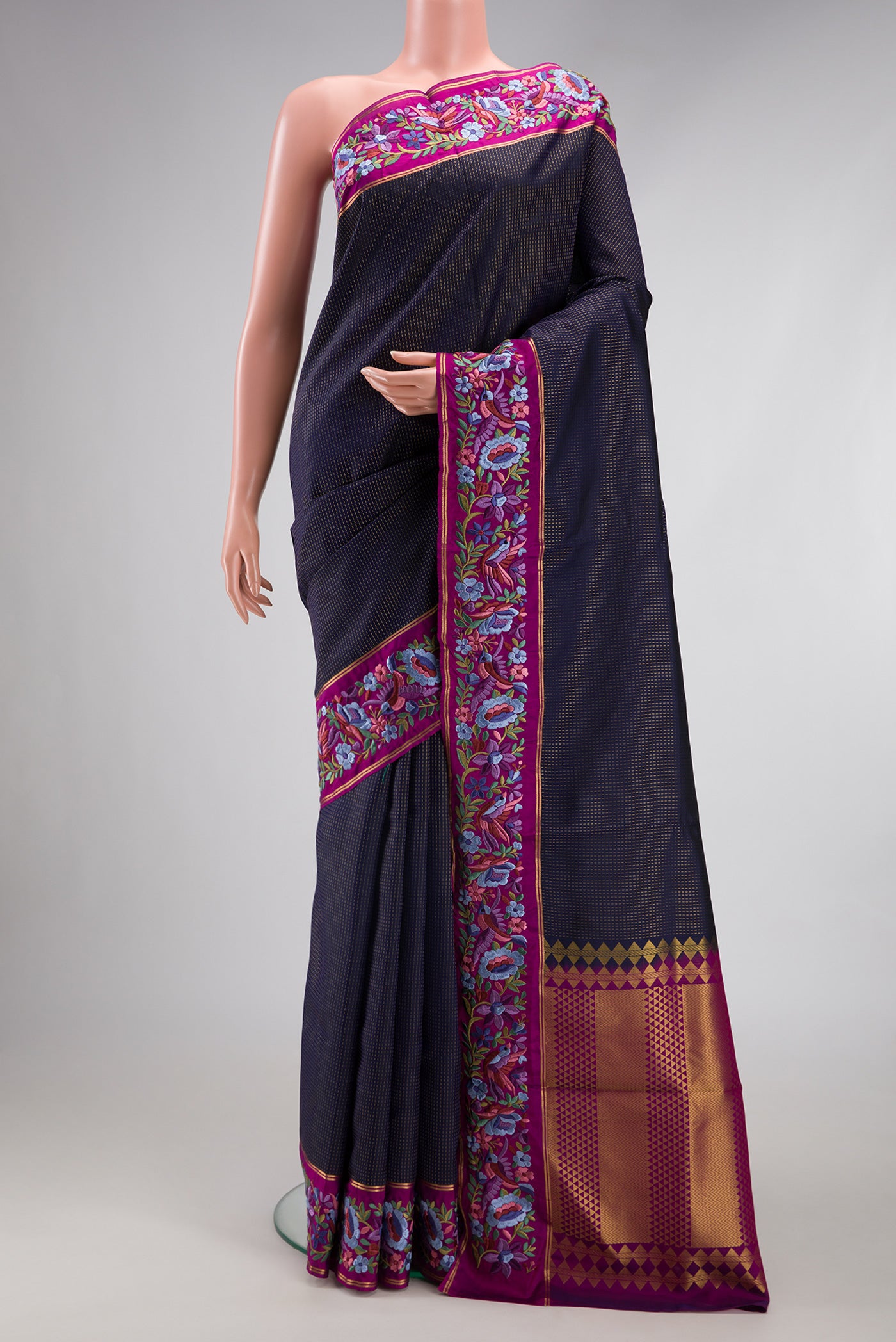 Navy Blue Dual Tone Banarasi Silk Saree with Stripes on the body and Embroidery Border.  displayed on a mannequin