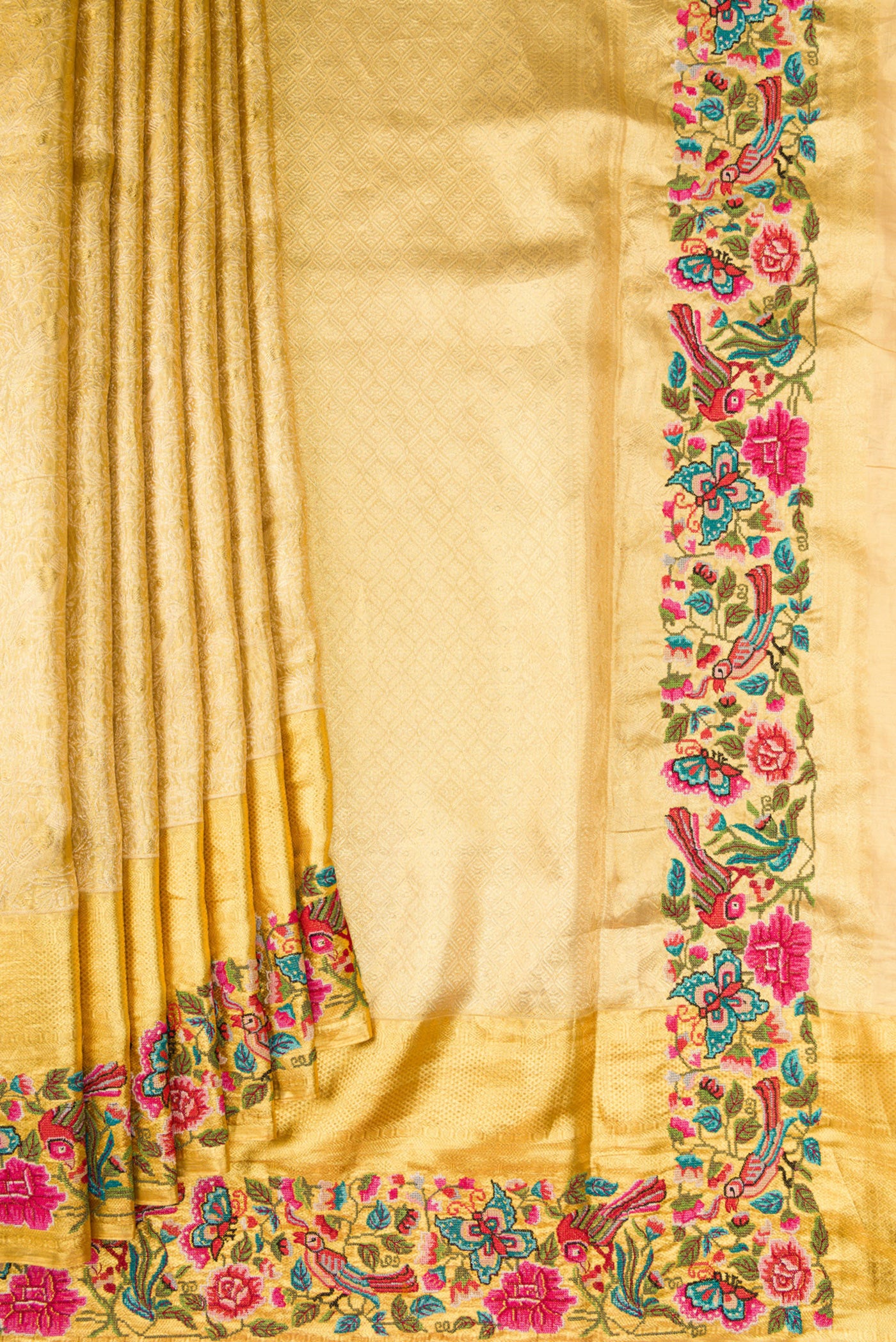 Pleats and pallu of Gold Dual Tone Kanjivaram Tissue Silk Saree with Zari Brocade on the body and Embroidery Border. 