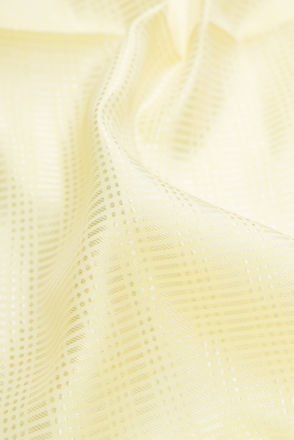 Close up of Pista Green Dual Tone Banarasi Silk Saree with Zari Brocade on the body and Embroidery Border.  displaying folds