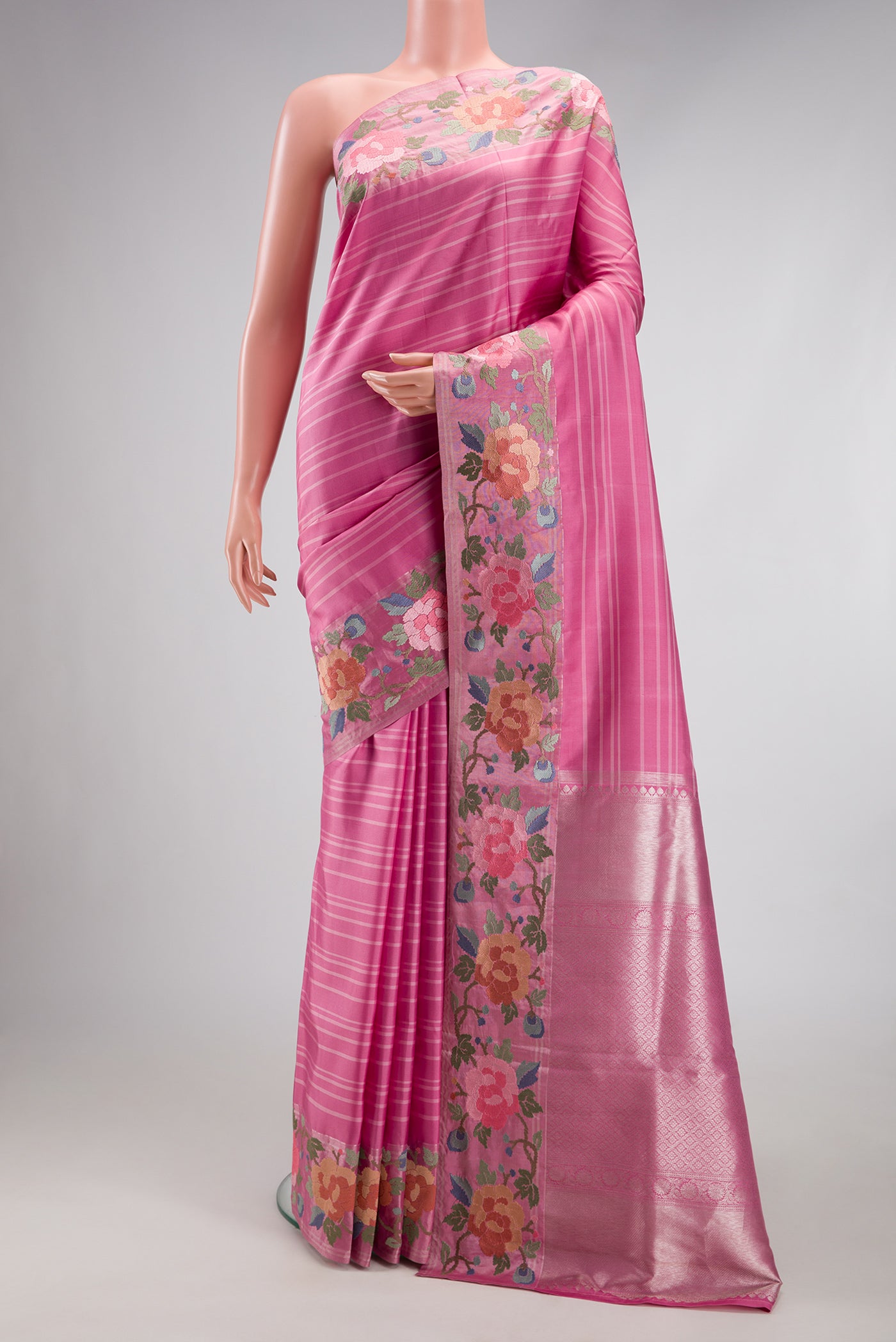 Pink Dual Tone Banarasi Silk Saree with Stripes on the body and Embroidery Border.  displayed on a mannequin