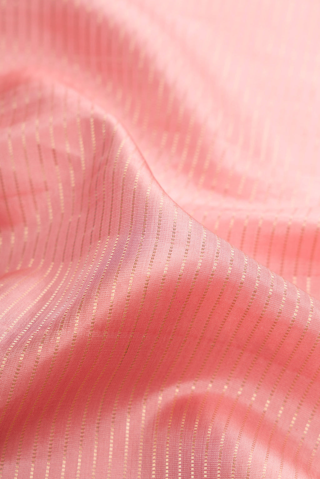 Close up of Rose pink Dual Tone Banarasi Silk Saree with Stripes on the body and Embroidery Border.  displaying folds
