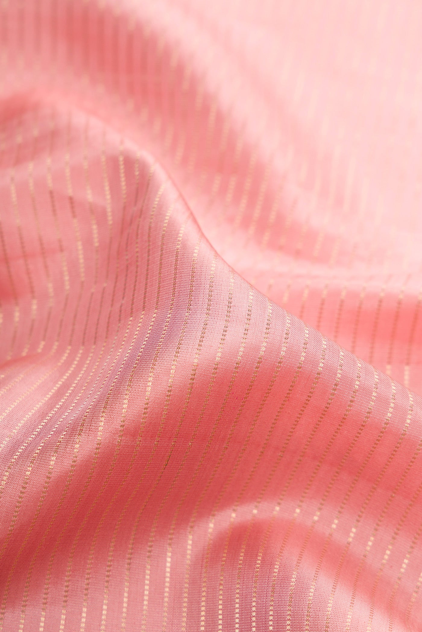Close up of Rose pink Dual Tone Banarasi Silk Saree with Stripes on the body and Embroidery Border.  displaying folds