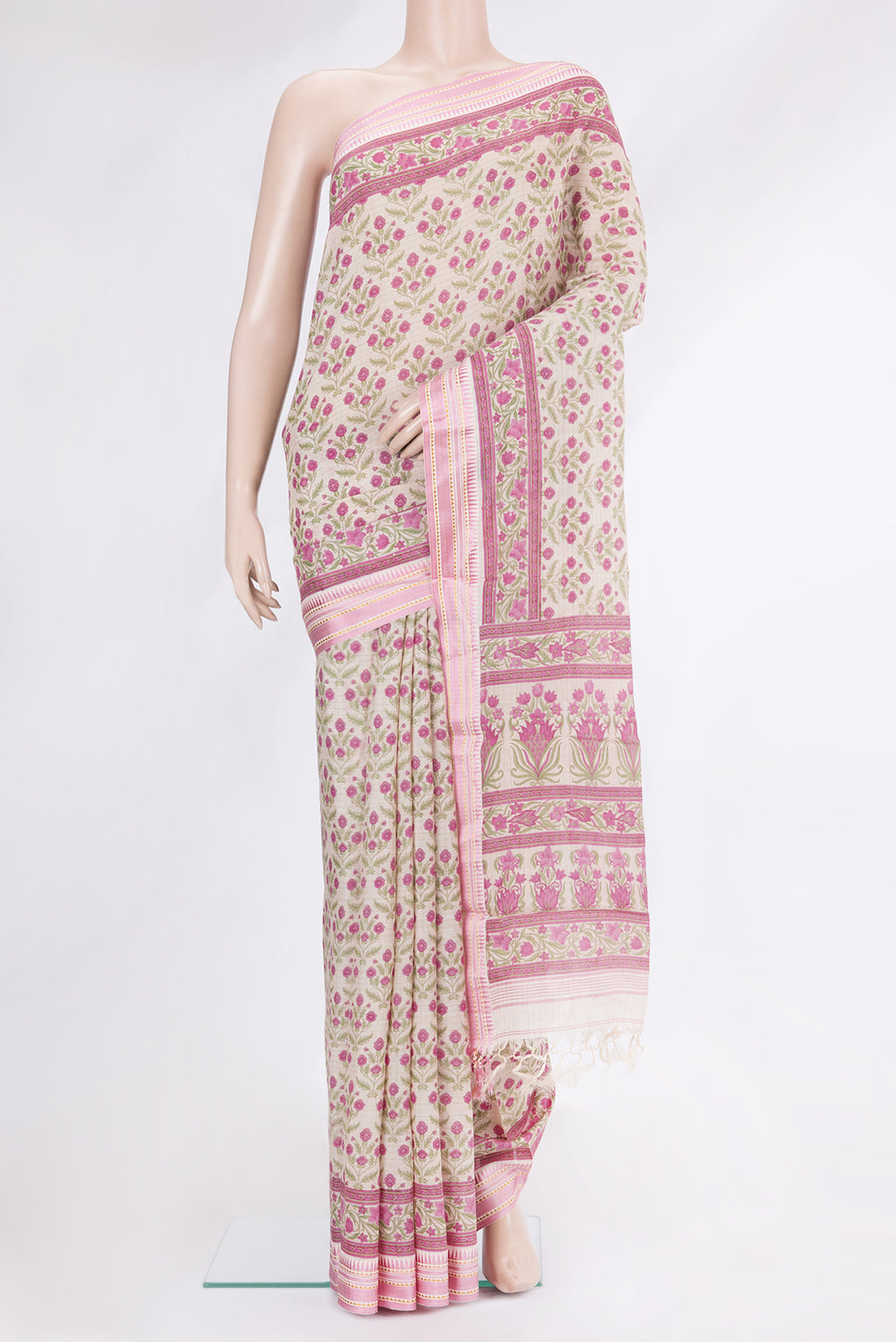 Beige Tussar Silk Saree with Printed design on the body and Zari And Thread Border.  displayed on a mannequin
