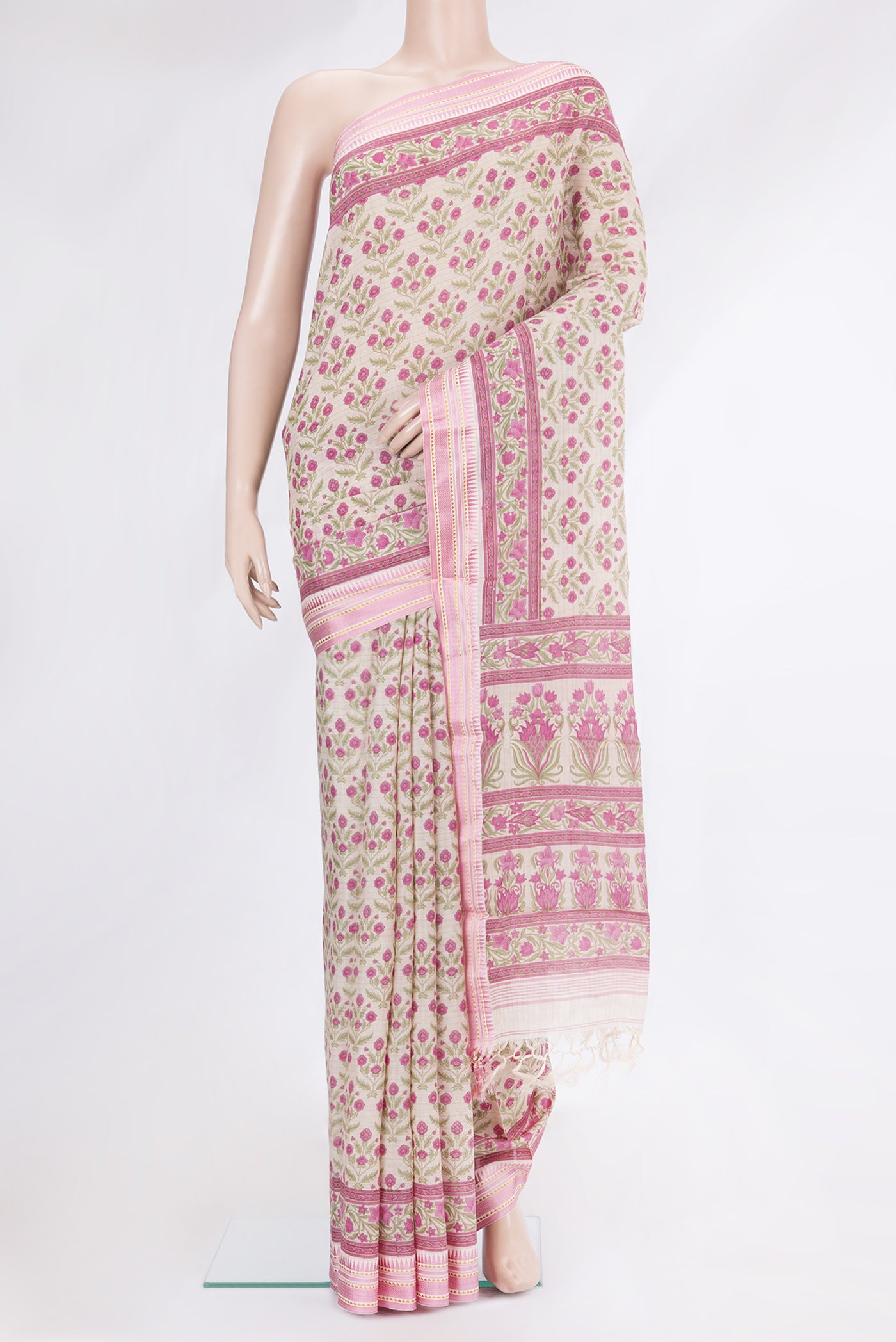 Beige Tussar Silk Saree with Printed design on the body and Zari And Thread Border.  displayed on a mannequin
