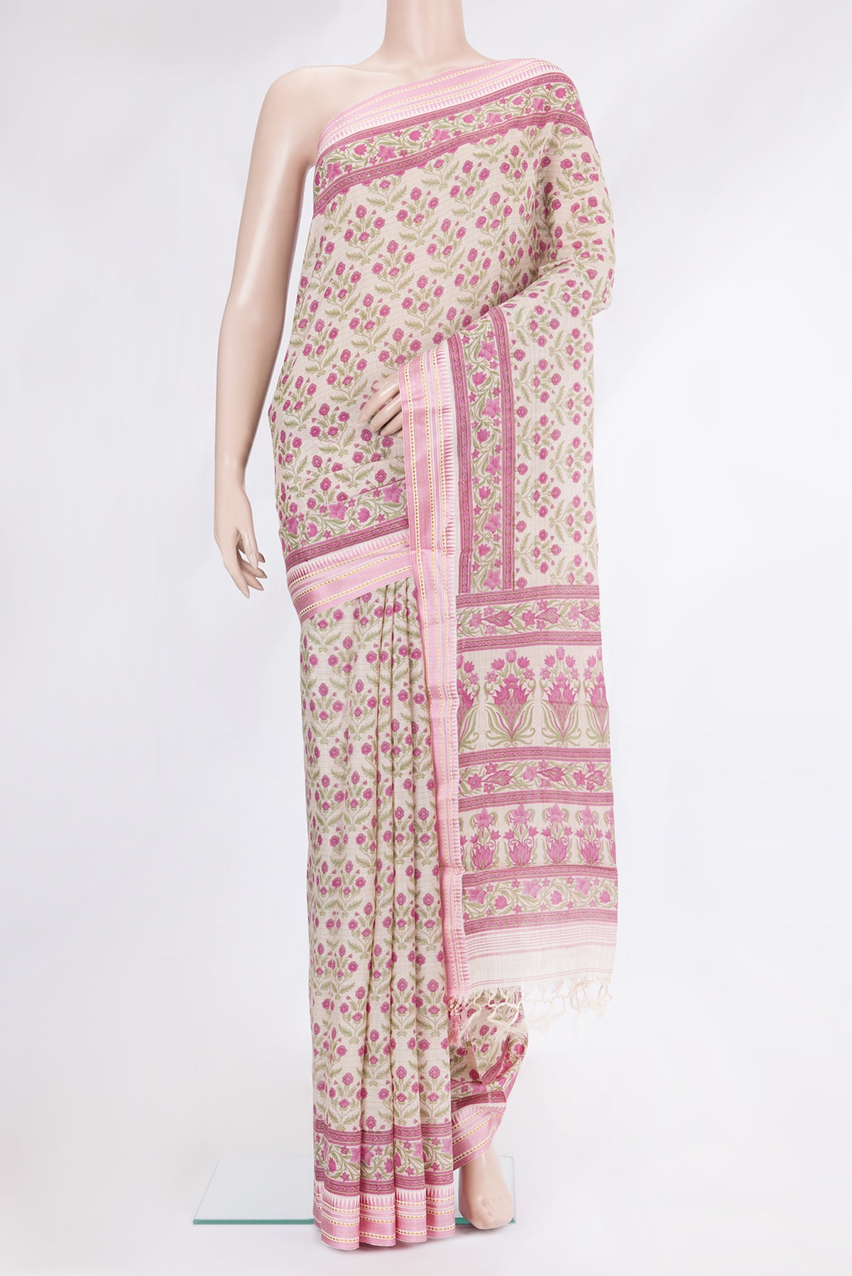 Beige Tussar Silk Saree with Printed design on the body and Zari And Thread Border.  displayed on a mannequin