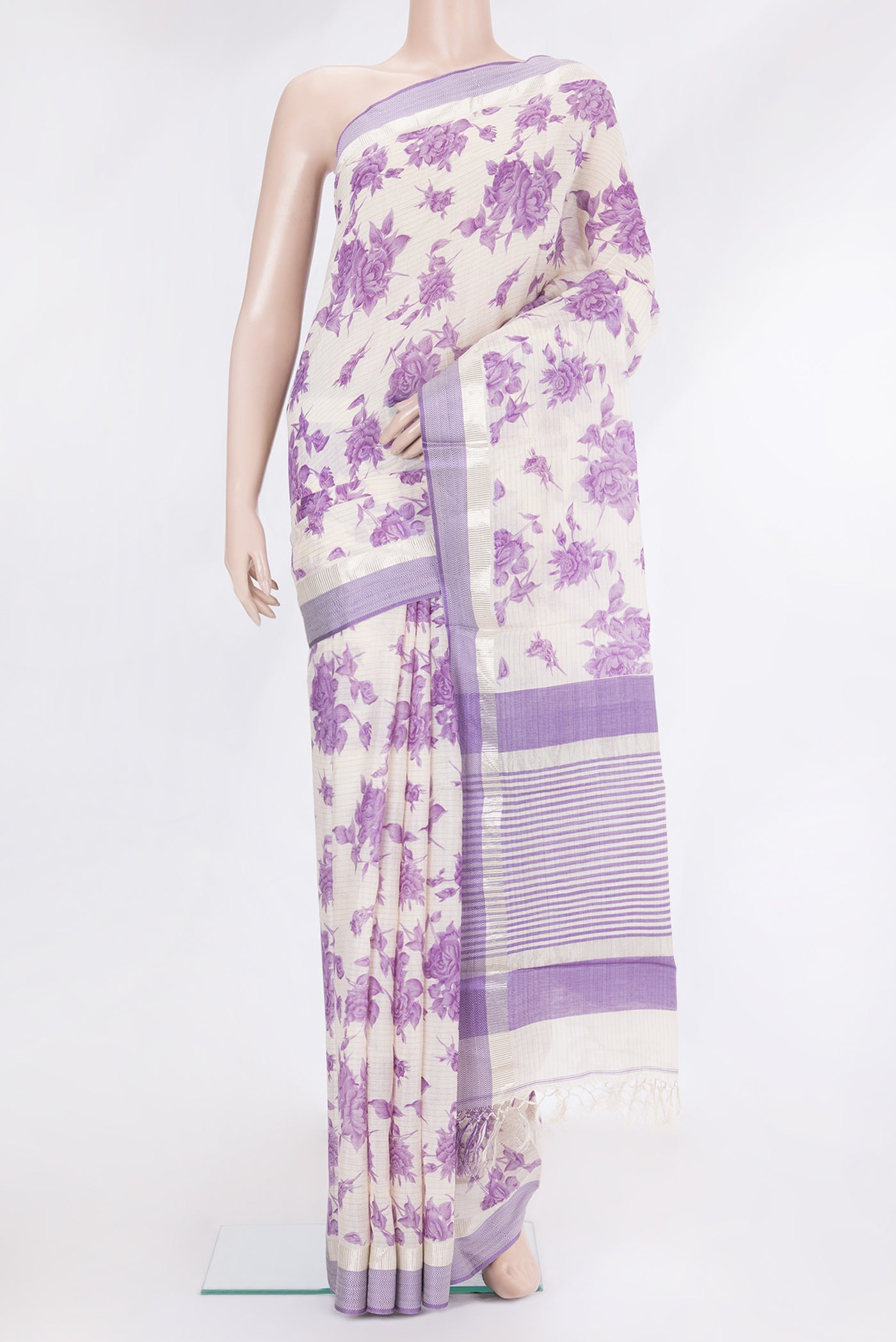 Cream Tussar Silk Saree with Floral Print on the body and Zari And Thread Border.  displayed on a mannequin