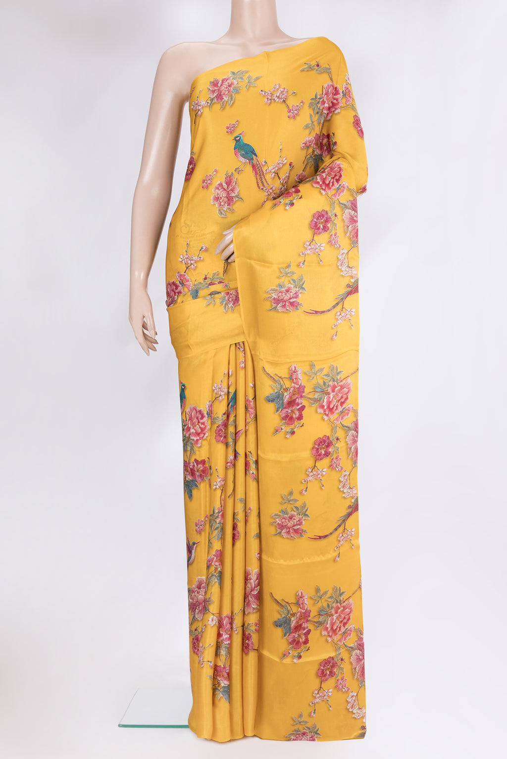 Yellow Crepe Saree with Floral Print on the body and Without Border.  displayed on a mannequin
