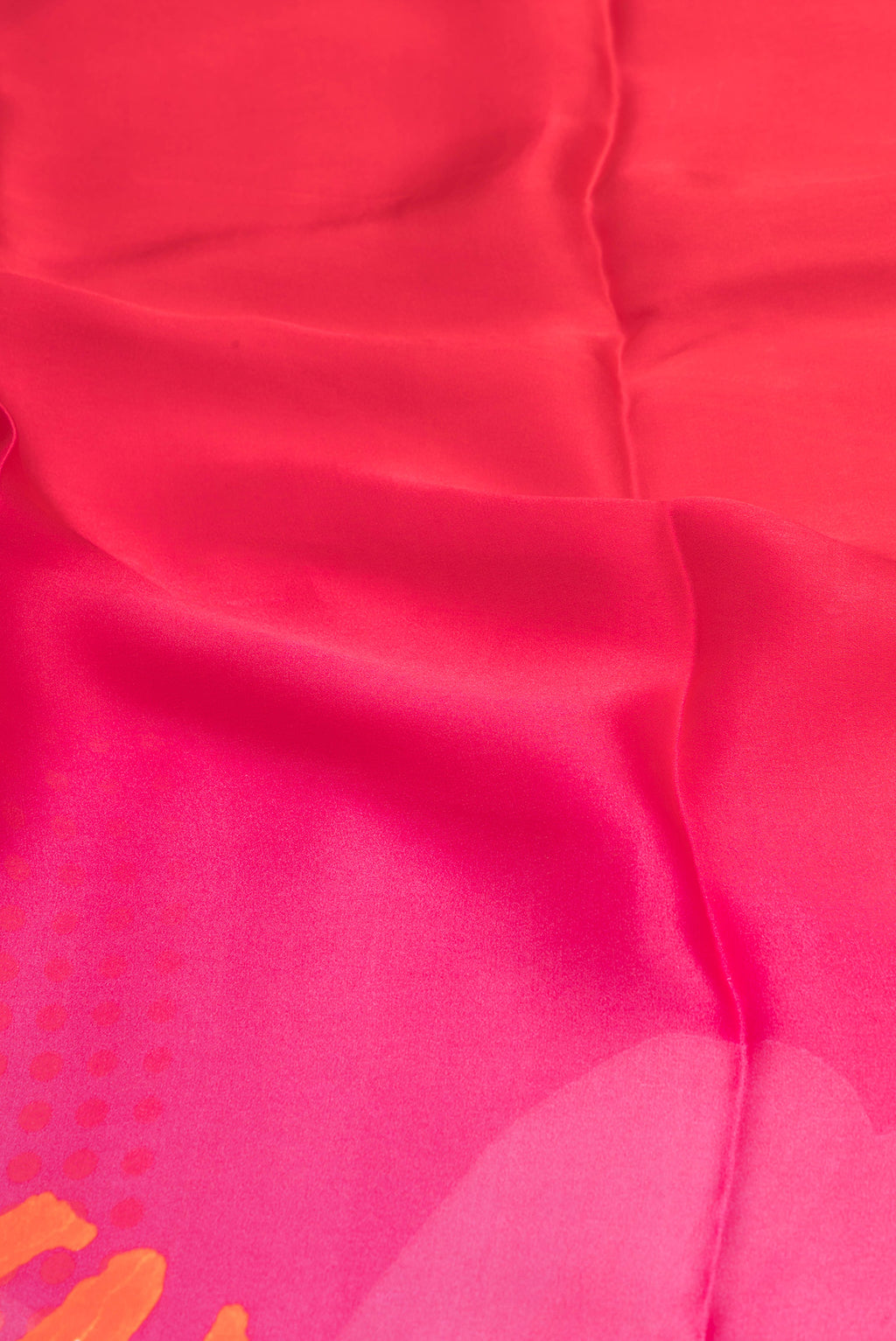 Close up of Dark Pink Crepe Saree with Printed design on the body and Plain Border.  displaying folds