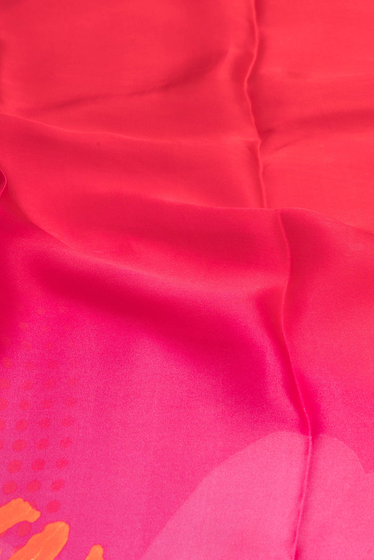 Close up of Dark Pink Crepe Saree with Printed design on the body and Plain Border.  displaying folds
